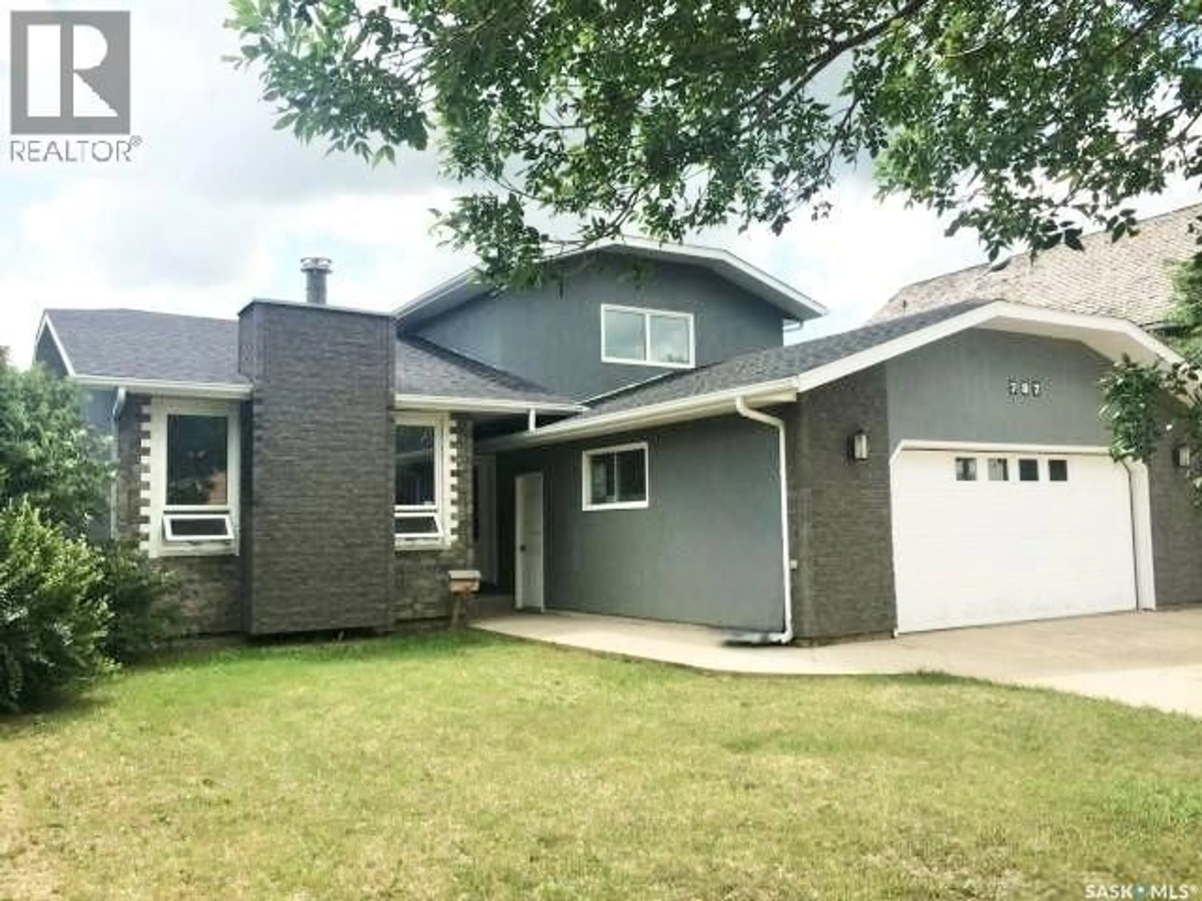 Home with vinyl exterior material, street for 787 BRIMACOMBE DRIVE, Weyburn Saskatchewan S4H2P7