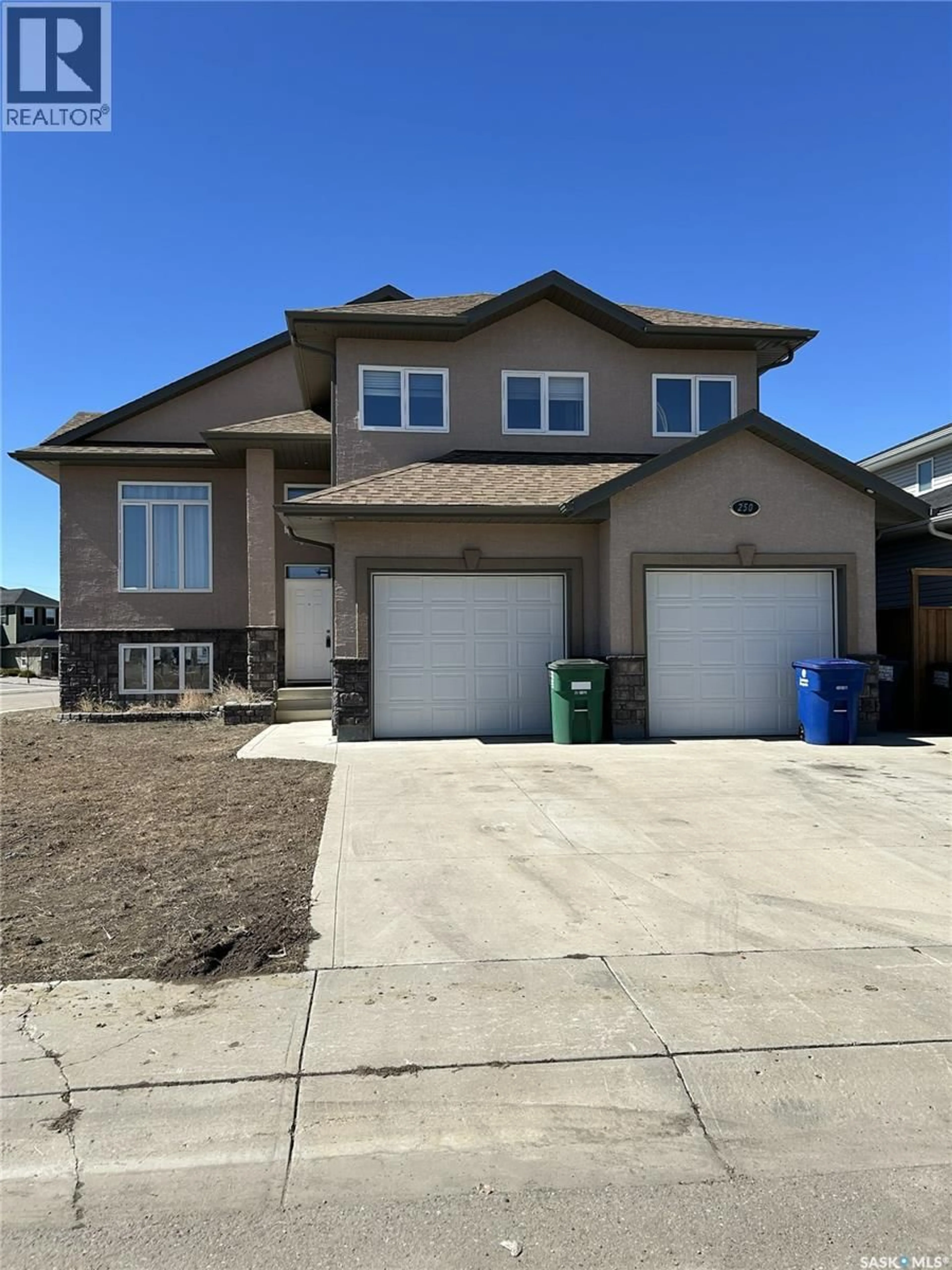 Home with brick exterior material, street for 250 PICHLER LANE, Saskatoon Saskatchewan S7V0G3