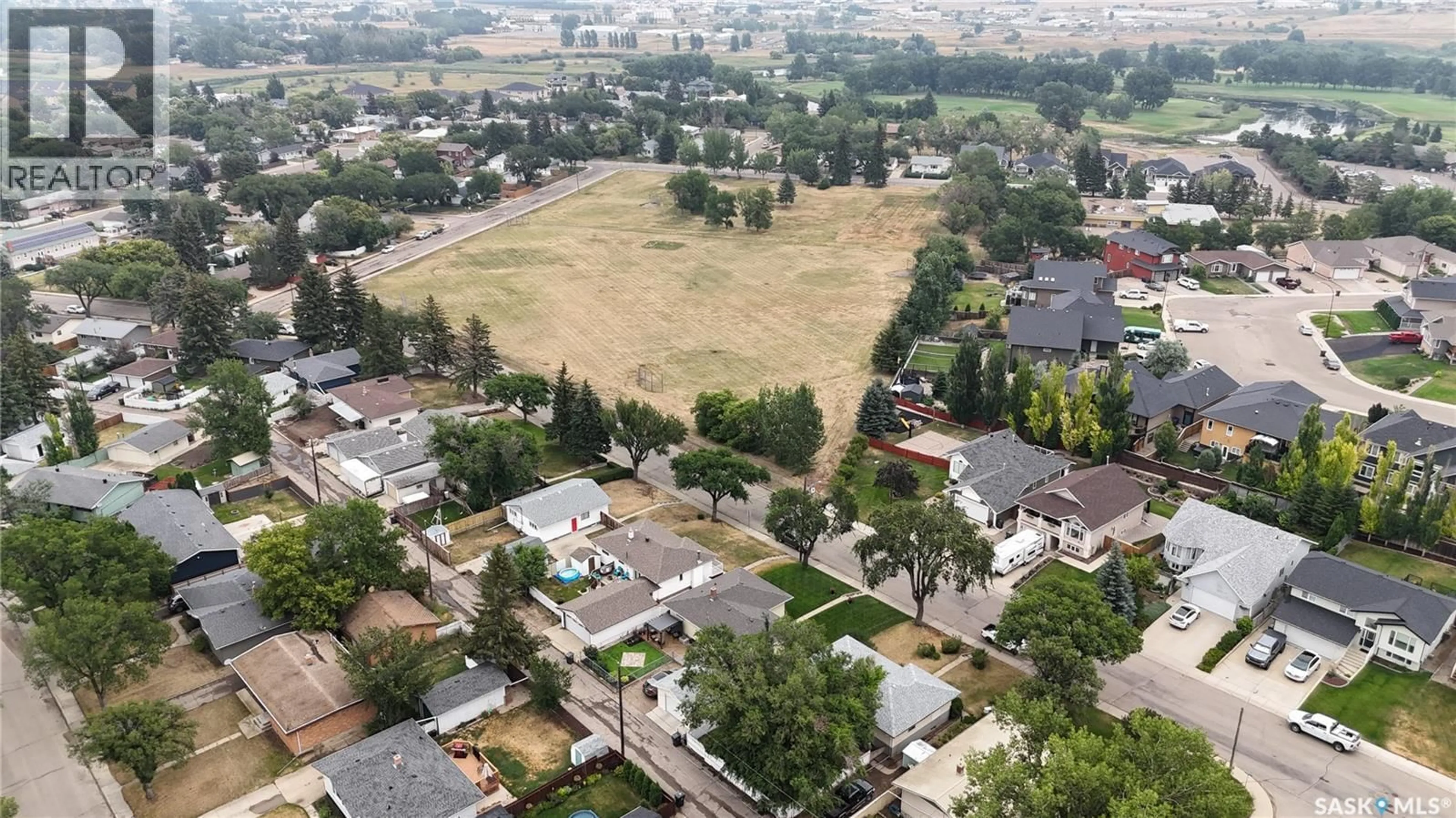 A pic from outside/outdoor area/front of a property/back of a property/a pic from drone, mountain view for 488 3RD AVENUE, Swift Current Saskatchewan S9H3K8