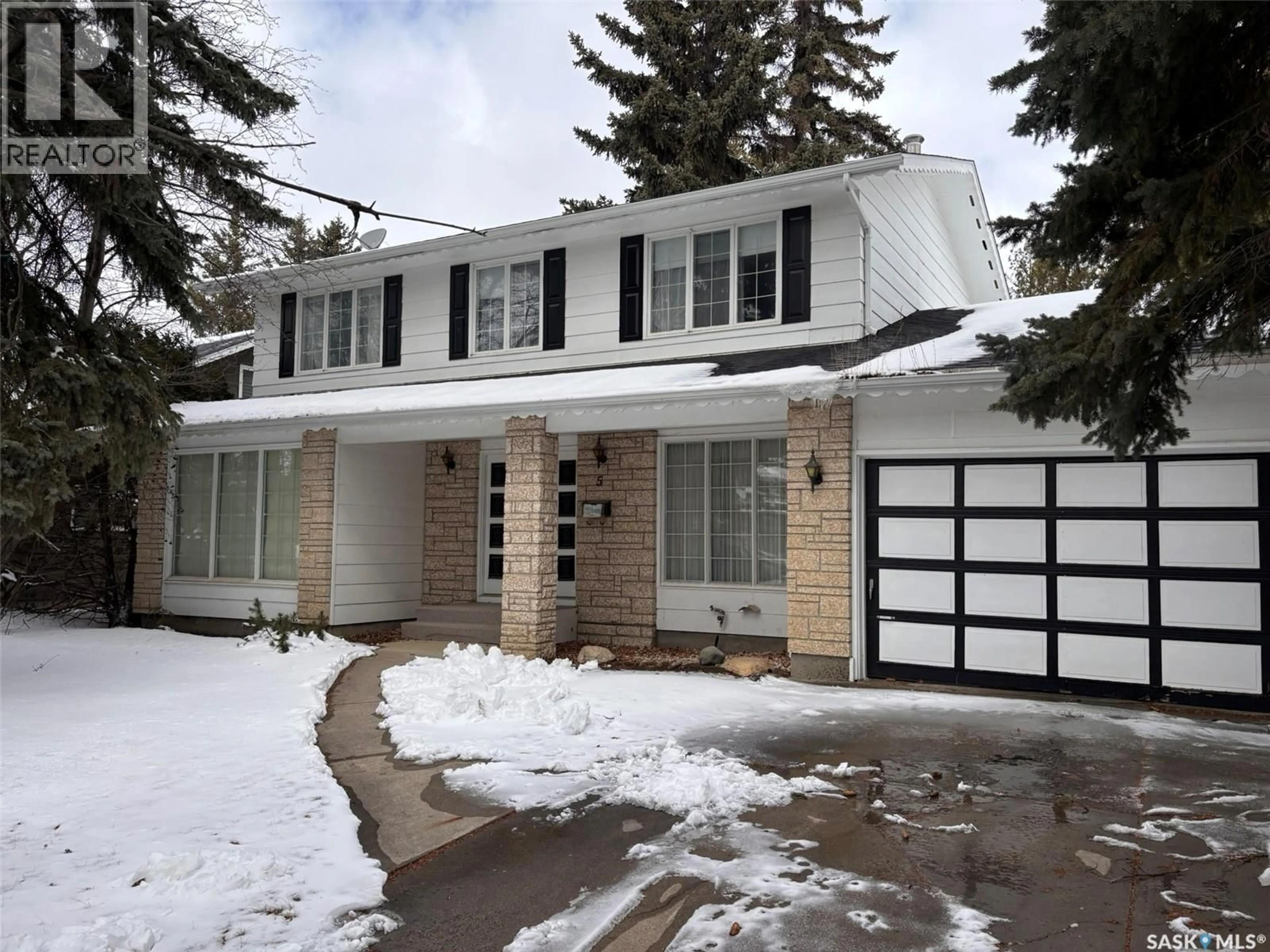 Home with vinyl exterior material, street for 5 MALCOLM PLACE, Saskatoon Saskatchewan S7H4M3