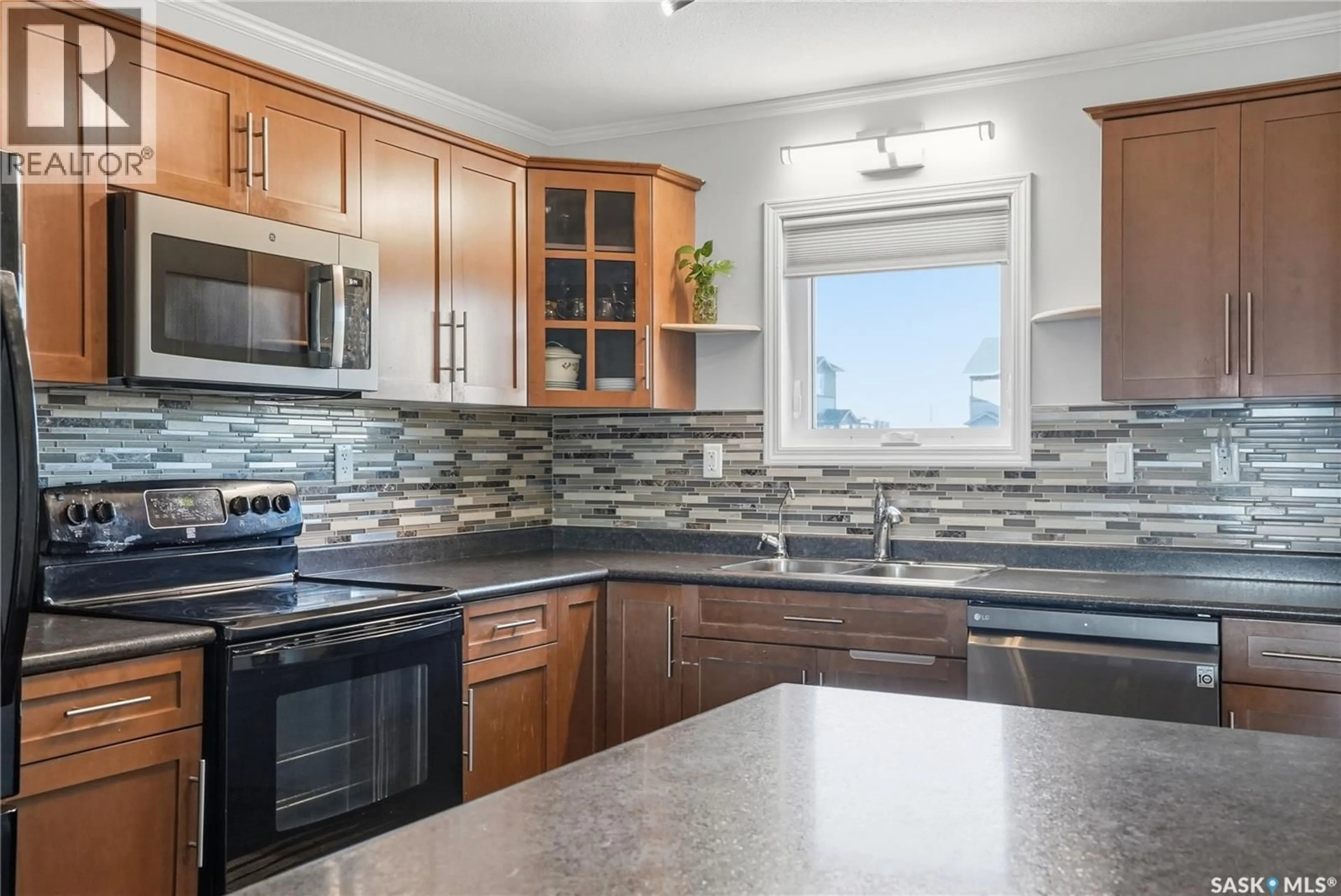 Open concept kitchen, ceramic/tile floor for 110 - 1303 RICHARDSON ROAD, Saskatoon Saskatchewan S7R0L1