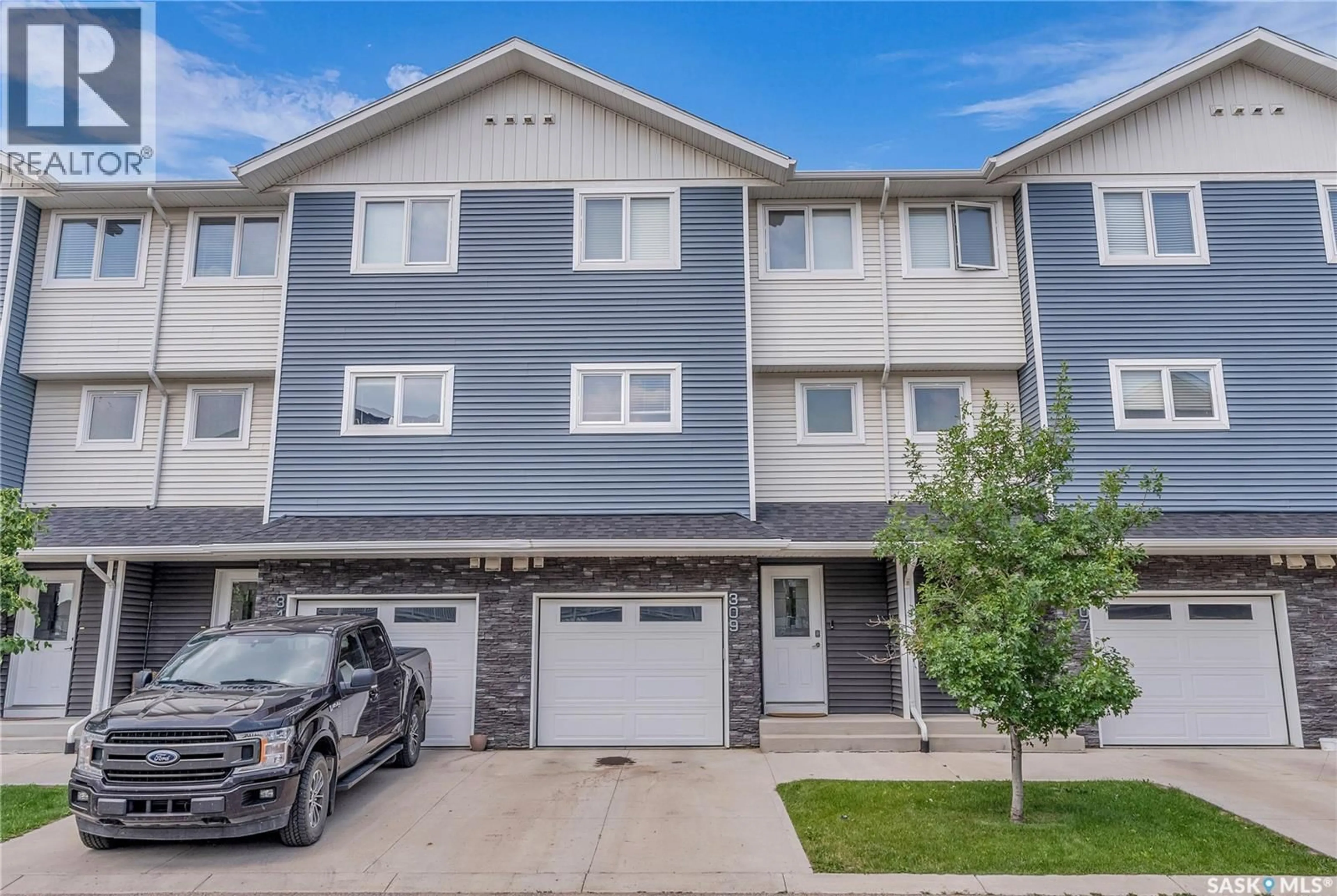 Home with vinyl exterior material, street for 309 315 KLOPPENBURG LINK, Saskatoon Saskatchewan S7W0V9