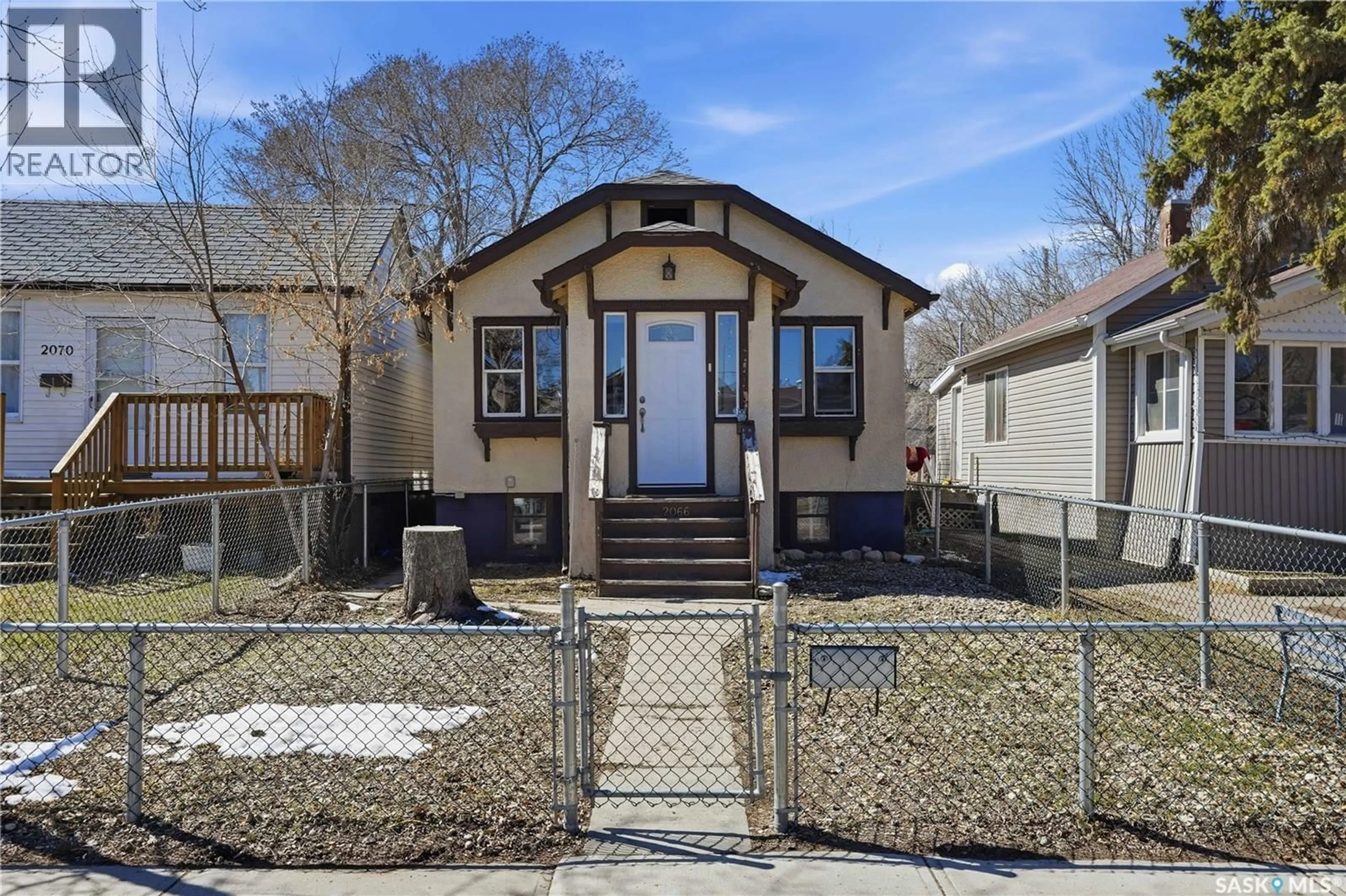 Home with vinyl exterior material, street for 2066 BRODER STREET, Regina Saskatchewan S4N3S2