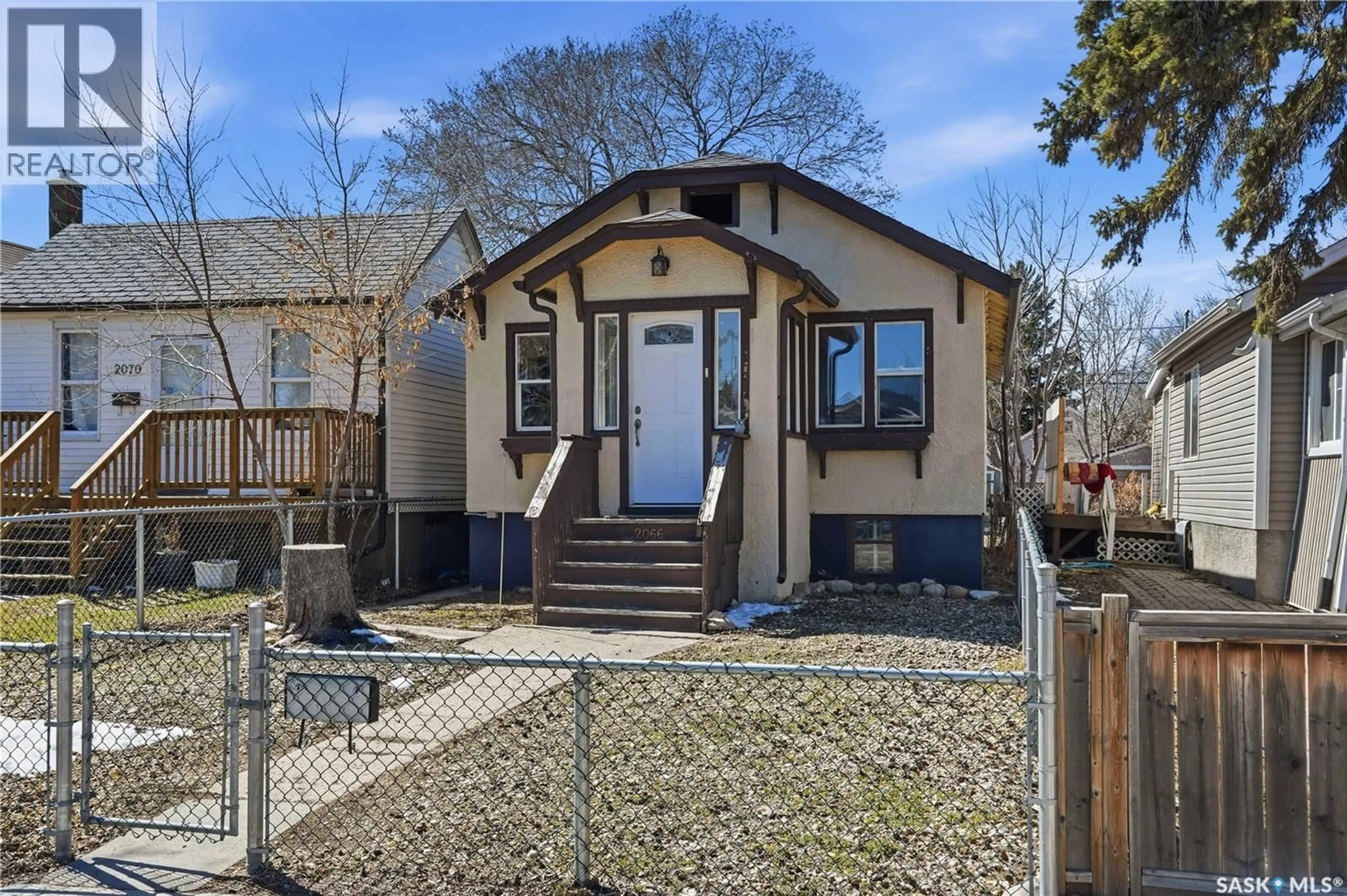 Home with vinyl exterior material, street for 2066 BRODER STREET, Regina Saskatchewan S4N3S2