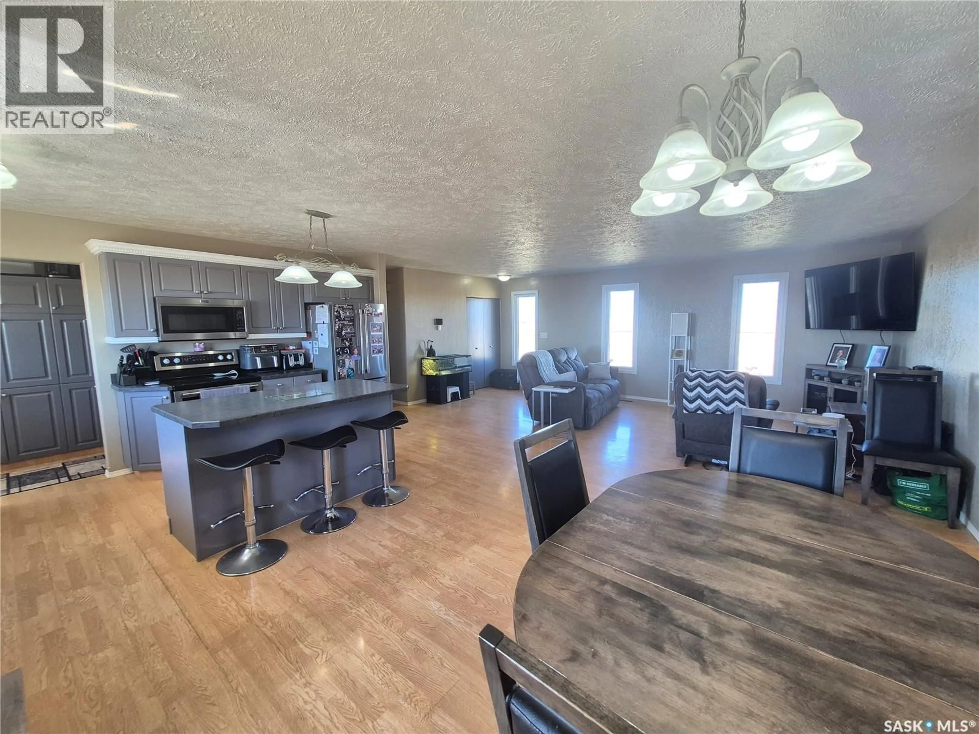 Open concept kitchen, wood/laminate floor for 13 ACREAGE HIGHWAY, Key West Rm No. 70 Saskatchewan S0C1Y0
