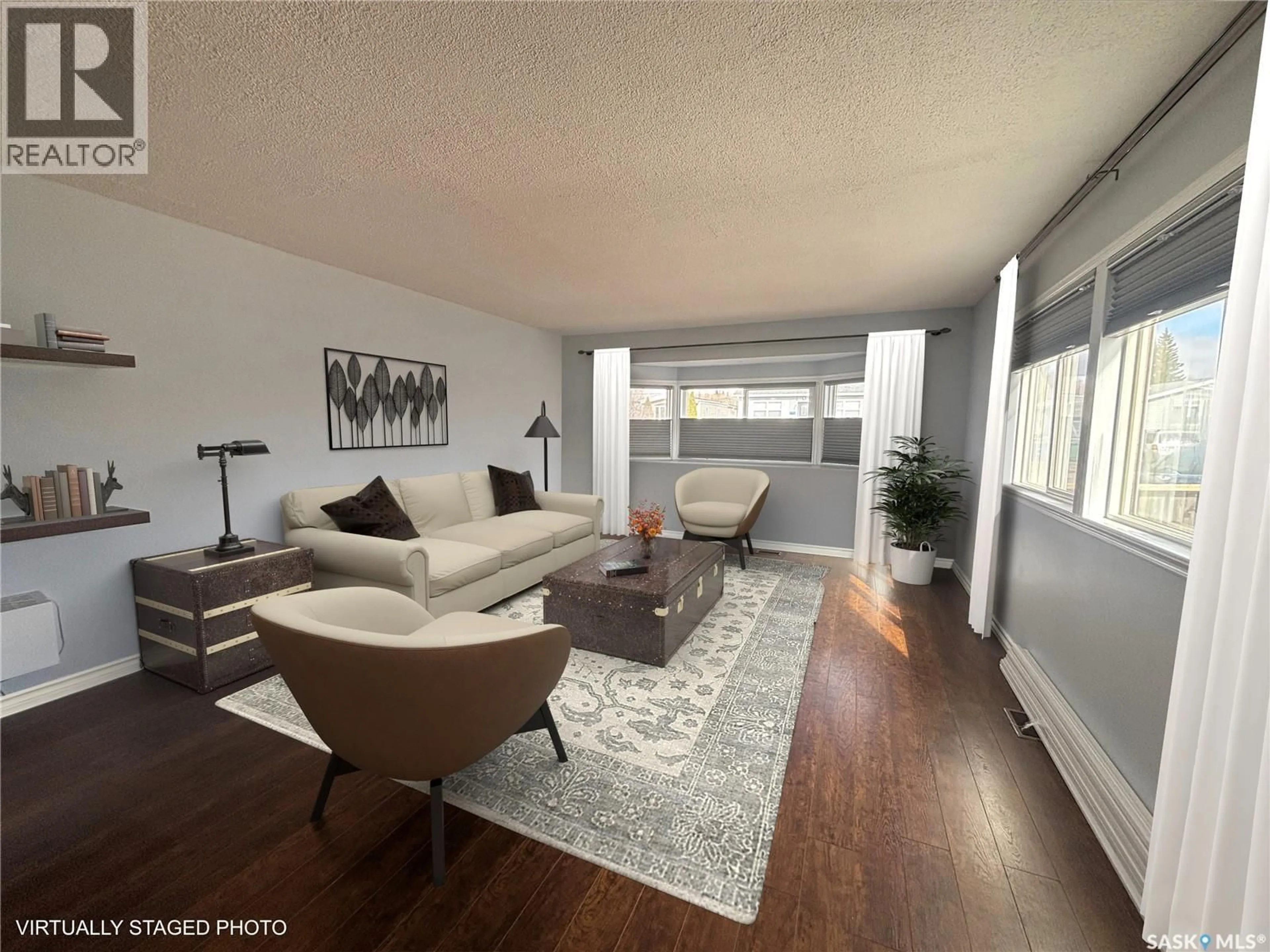 Living room with furniture, wood/laminate floor for 354 HAWKES STREET, Balgonie Saskatchewan S0G0E0