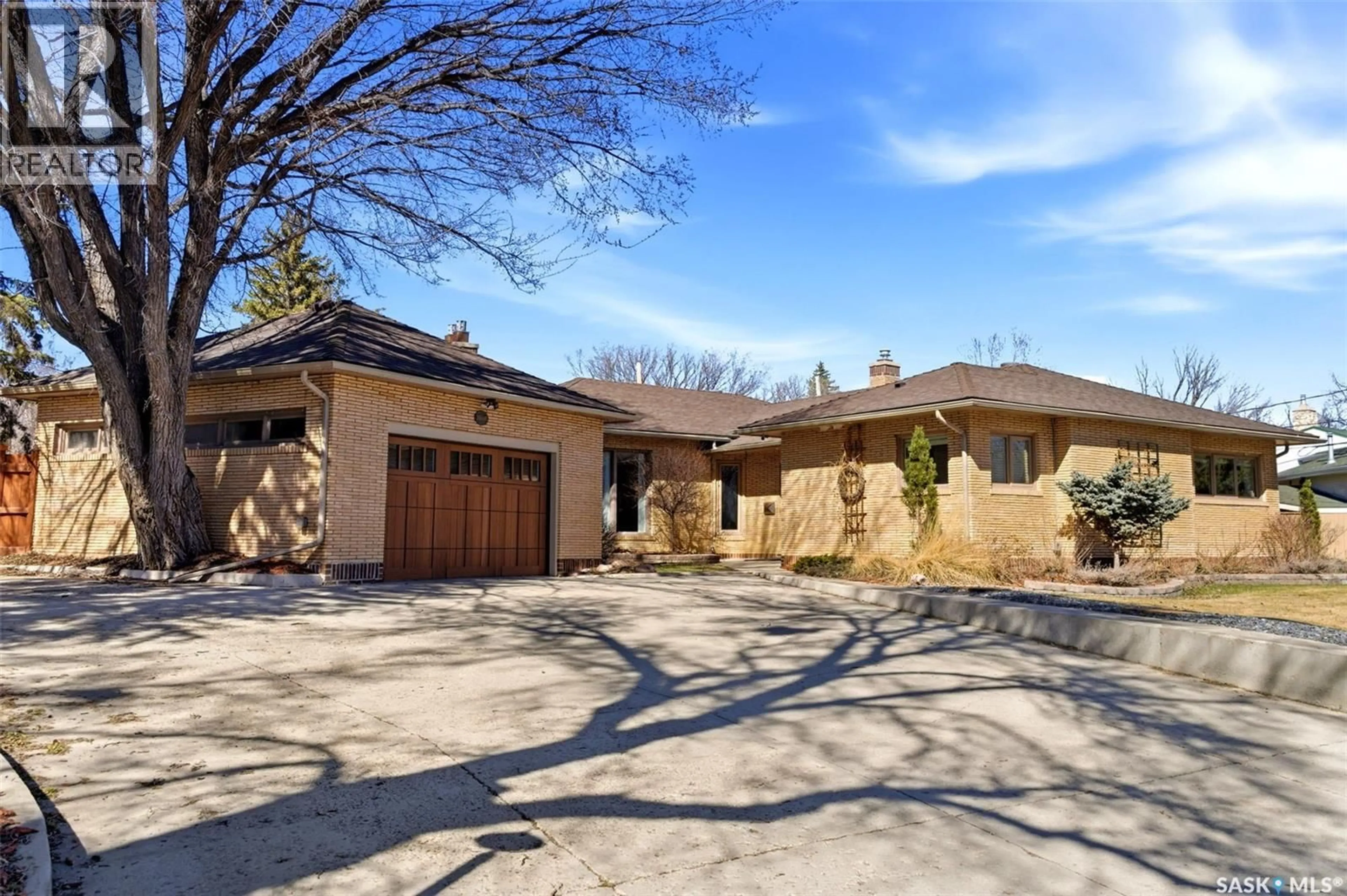 Home with brick exterior material, street for 2640 19TH AVENUE, Regina Saskatchewan S4T1X1