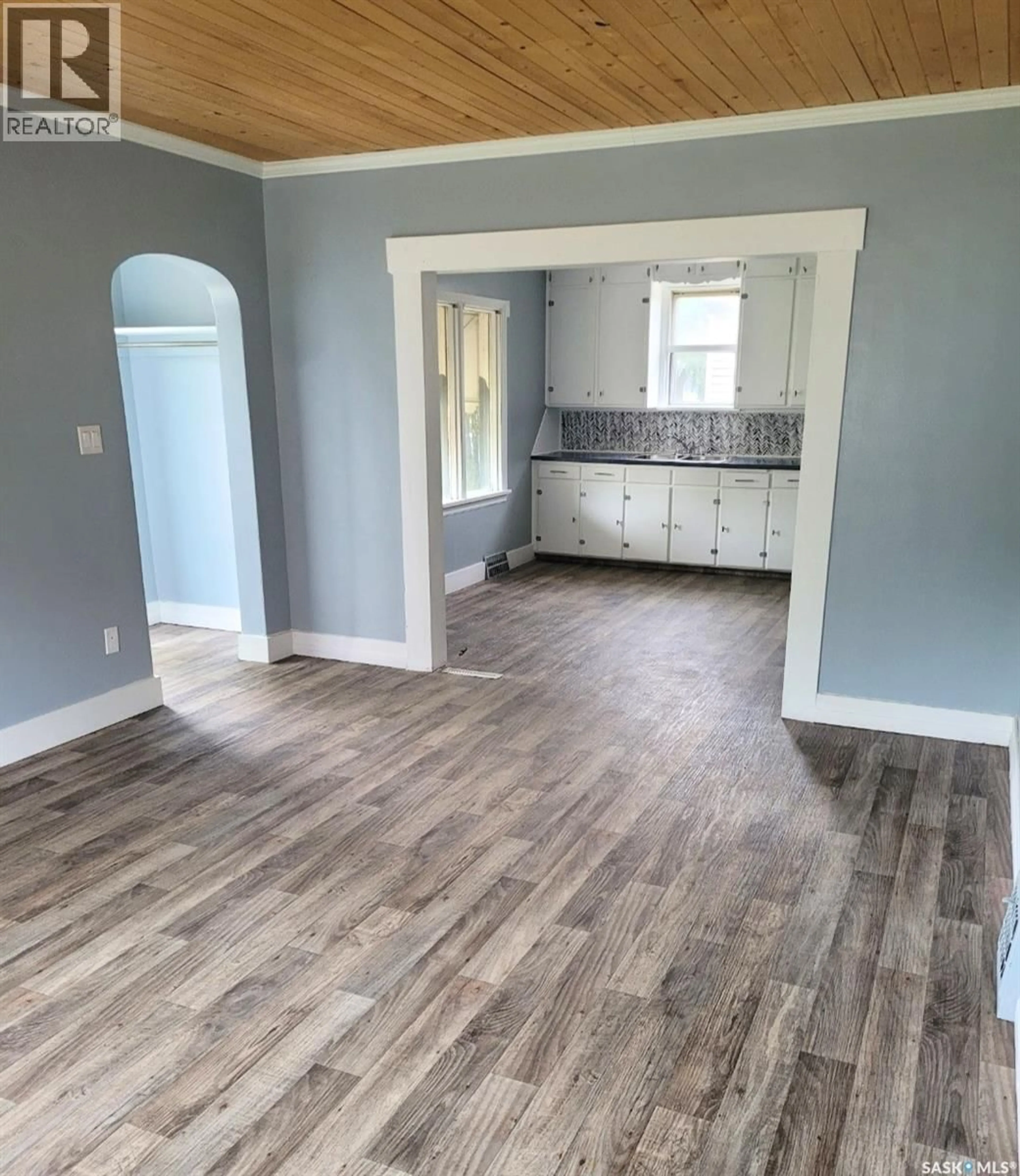 Open concept kitchen, wood/laminate floor for 211 BROADWAY STREET, Yorkton Saskatchewan S3N0M9