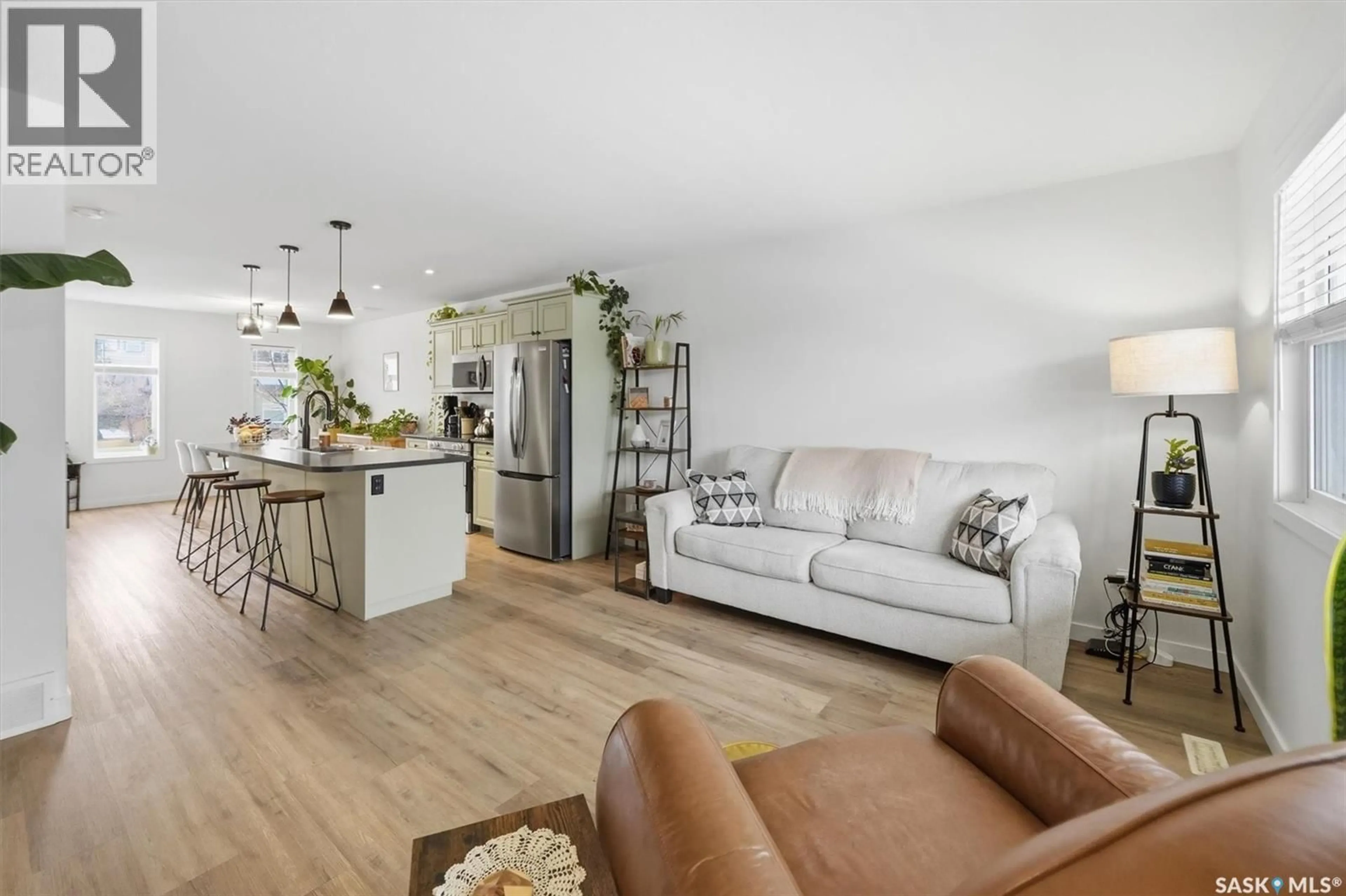 Open concept kitchen, wood/laminate floor for 344 LEVALLEY COVE, Saskatoon Saskatchewan S7T0L1