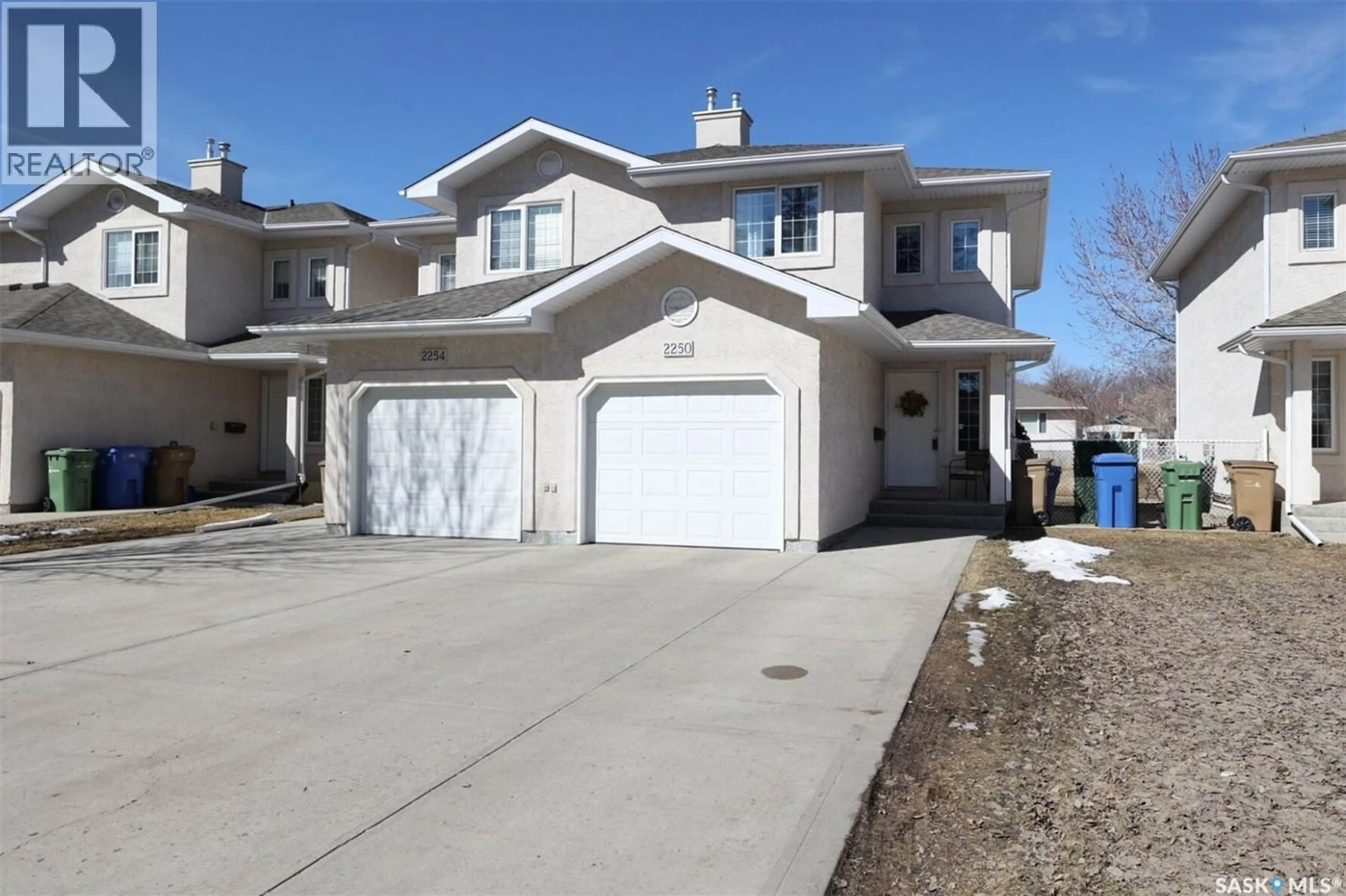 Home with vinyl exterior material, street for 2250 ATKINSON STREET, Regina Saskatchewan S4N7R2