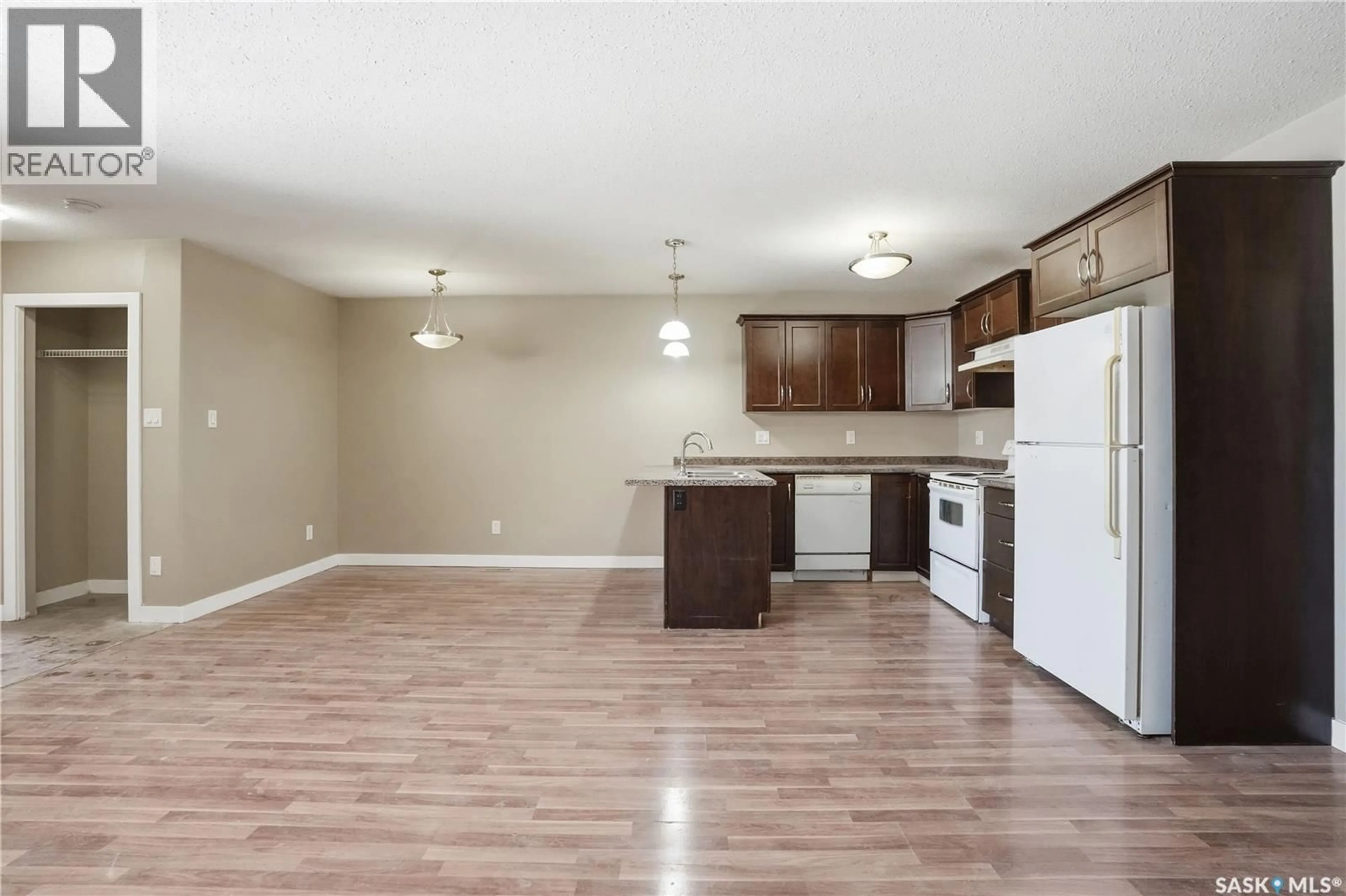 Open concept kitchen, wood/laminate floor for 1152 CAMERON STREET, Regina Saskatchewan S4T2S8