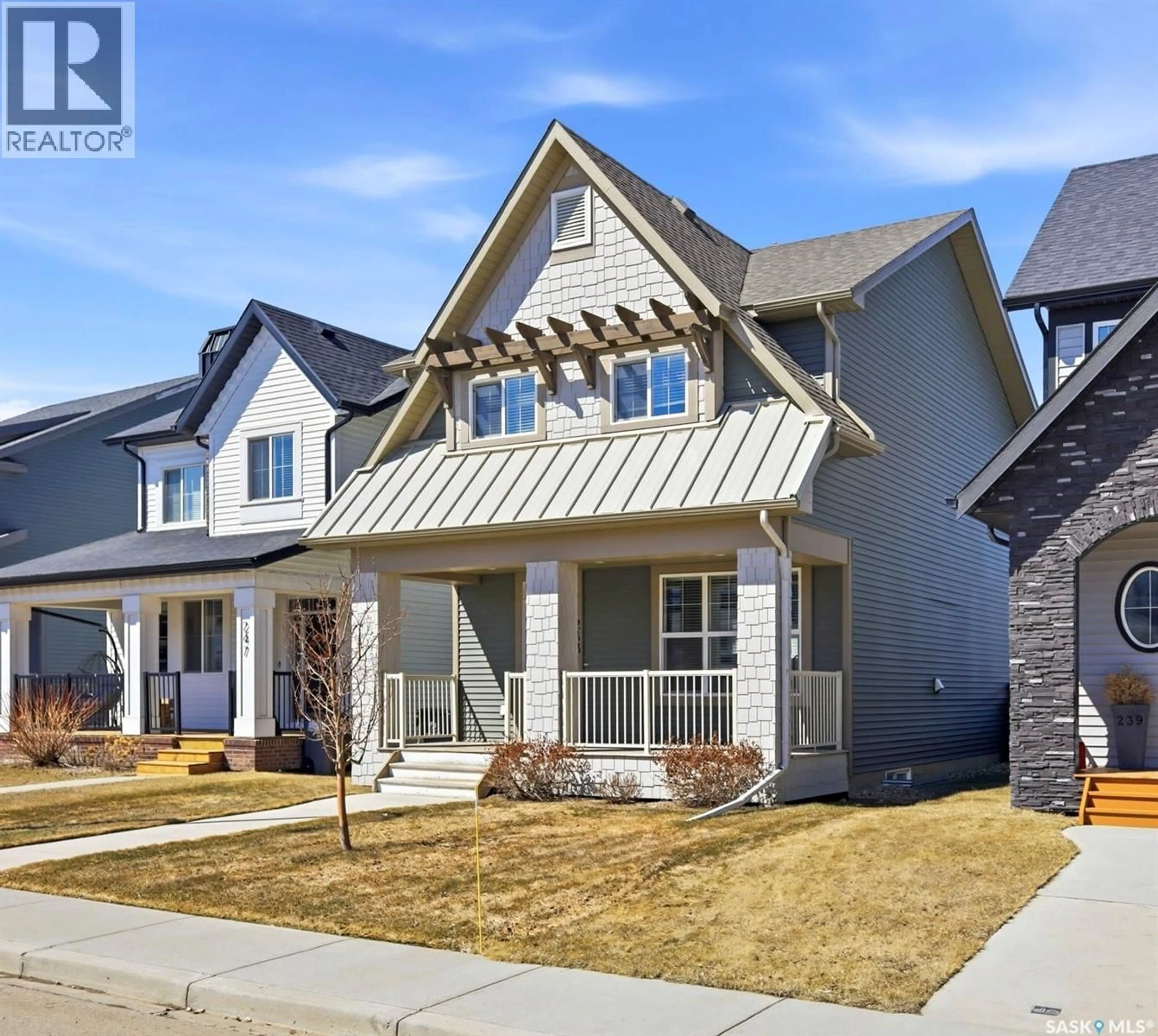 Home with vinyl exterior material, street for 243 NEWTON LINK, Saskatoon Saskatchewan S7V0M8