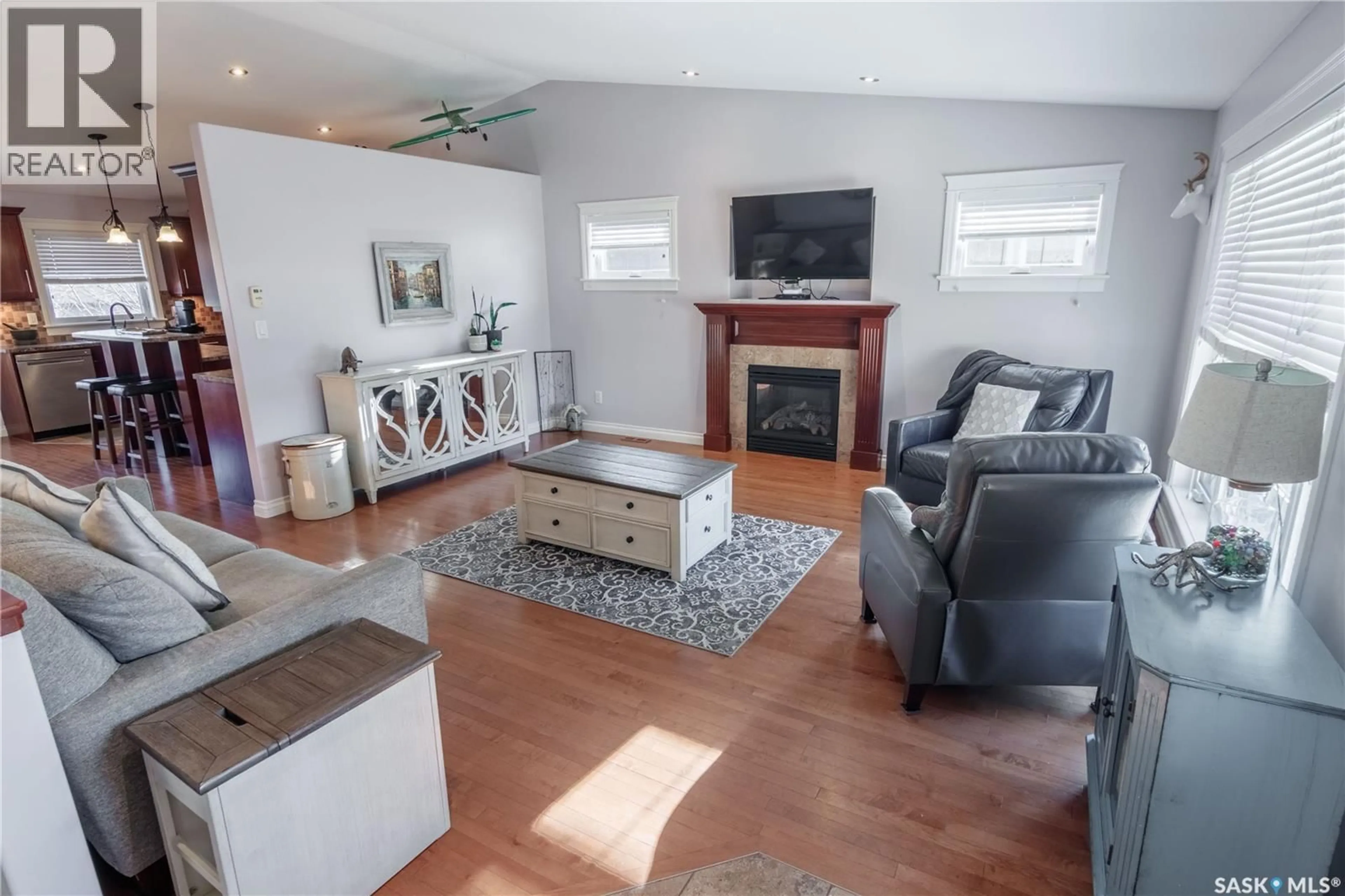 Living room with furniture, wood/laminate floor for 325 WESTVIEW DRIVE, Balgonie Saskatchewan S0G0E0