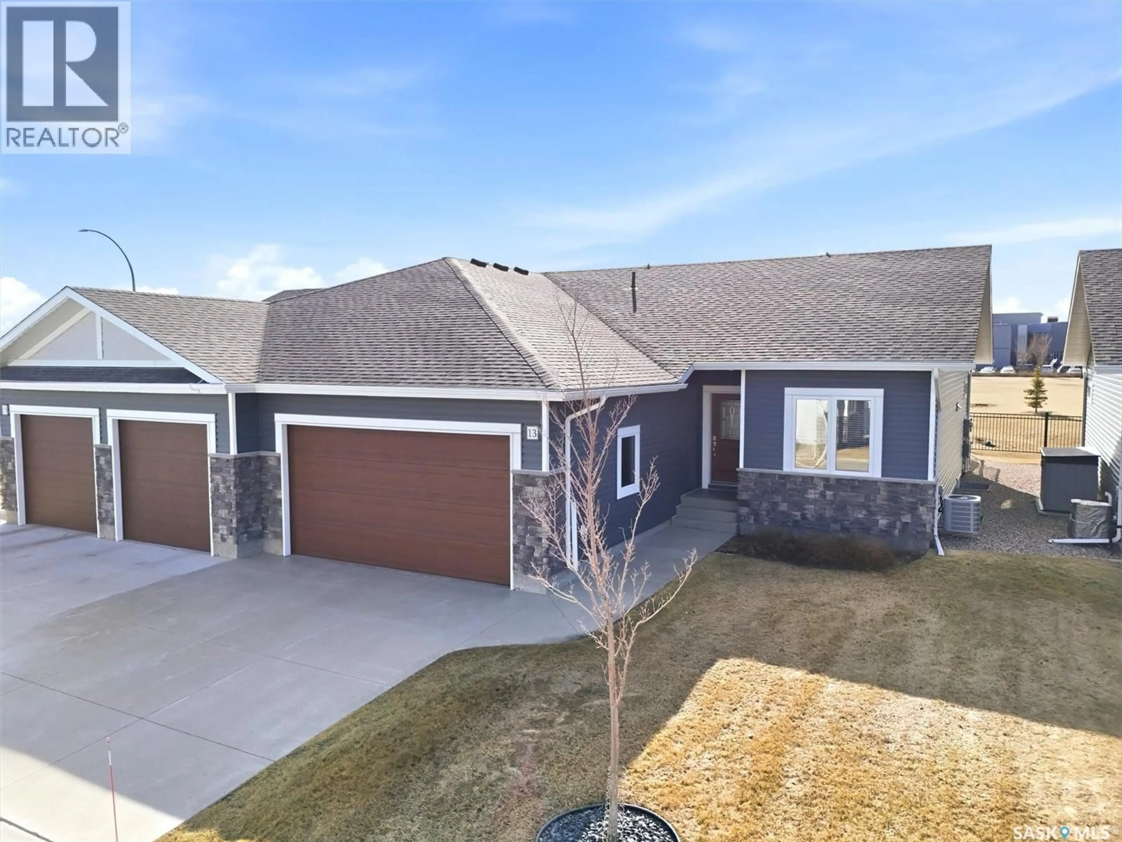 A pic from outside/outdoor area/front of a property/back of a property/a pic from drone, street for 315 - 13 OLSON LANE, Saskatoon Saskatchewan S7V0R8