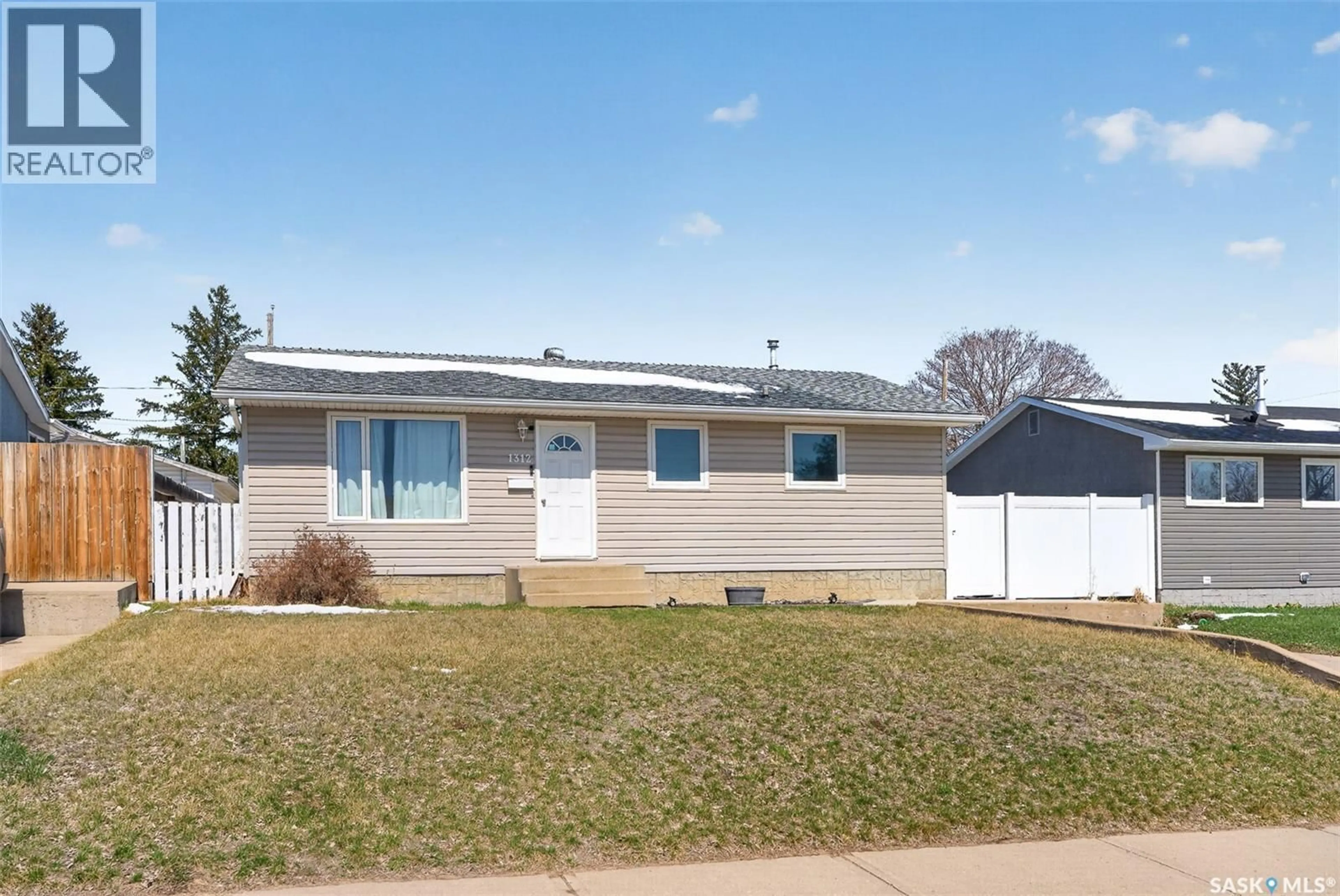 Home with vinyl exterior material, street for 1312 STADACONA STREET, Moose Jaw Saskatchewan S6H6M9