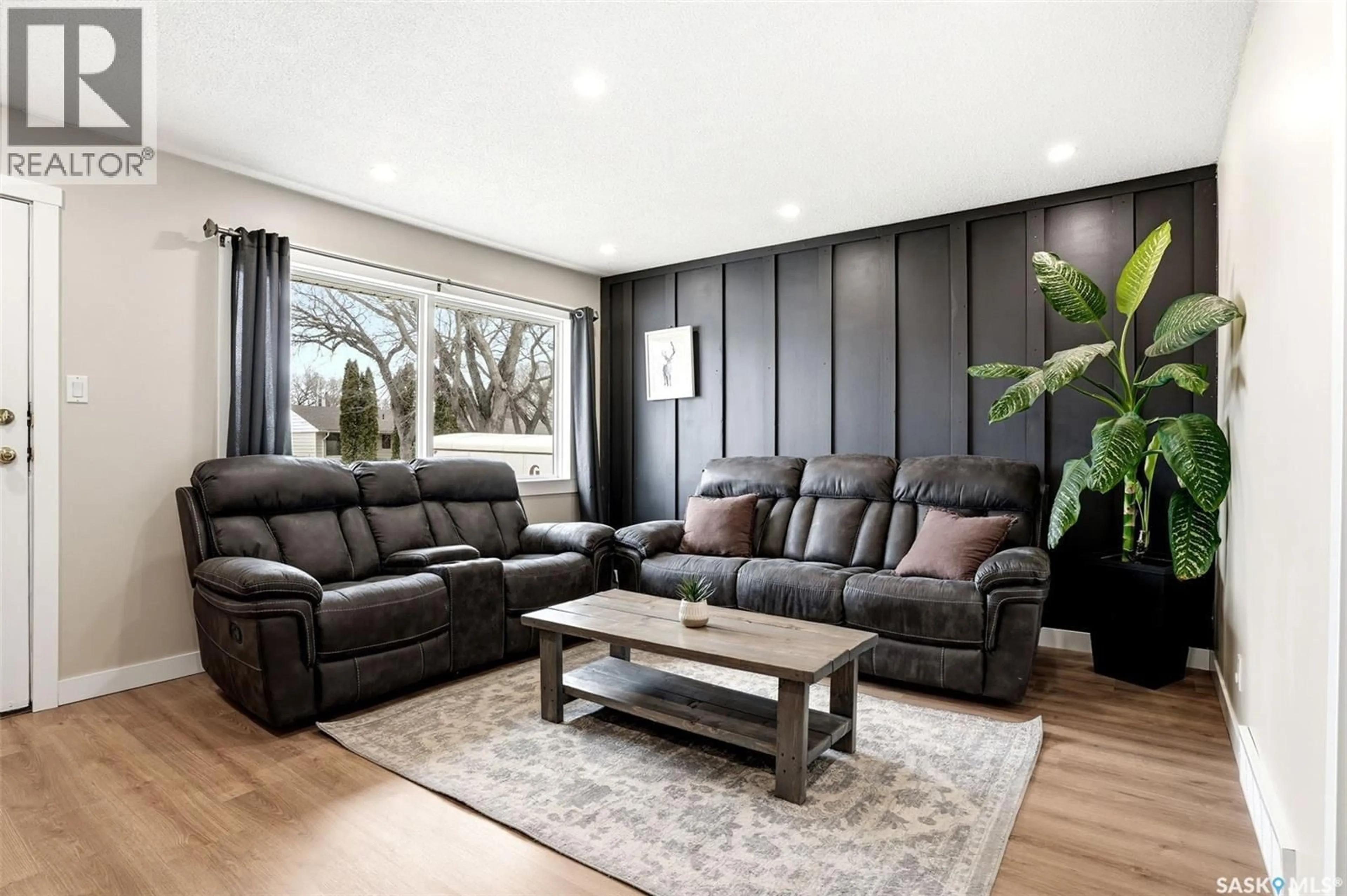 Living room with furniture, wood/laminate floor for 110 OTTAWA STREET, Regina Saskatchewan S4R1N2