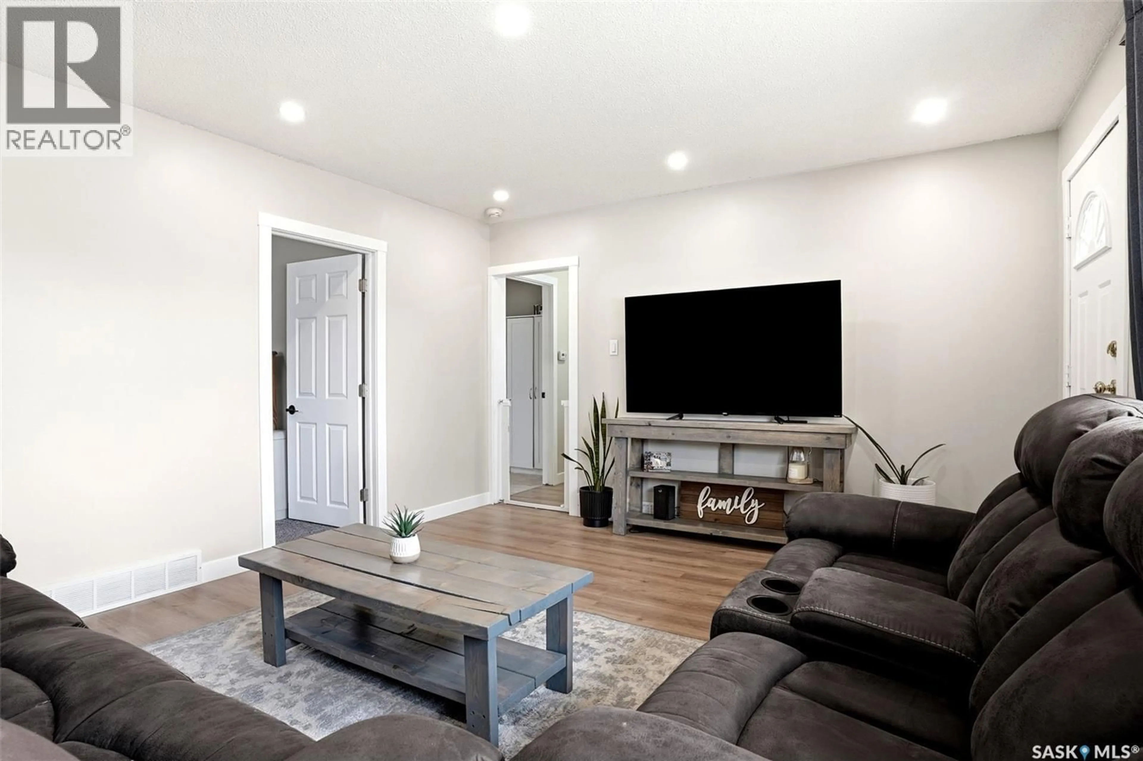 Living room with furniture, wood/laminate floor for 110 OTTAWA STREET, Regina Saskatchewan S4R1N2
