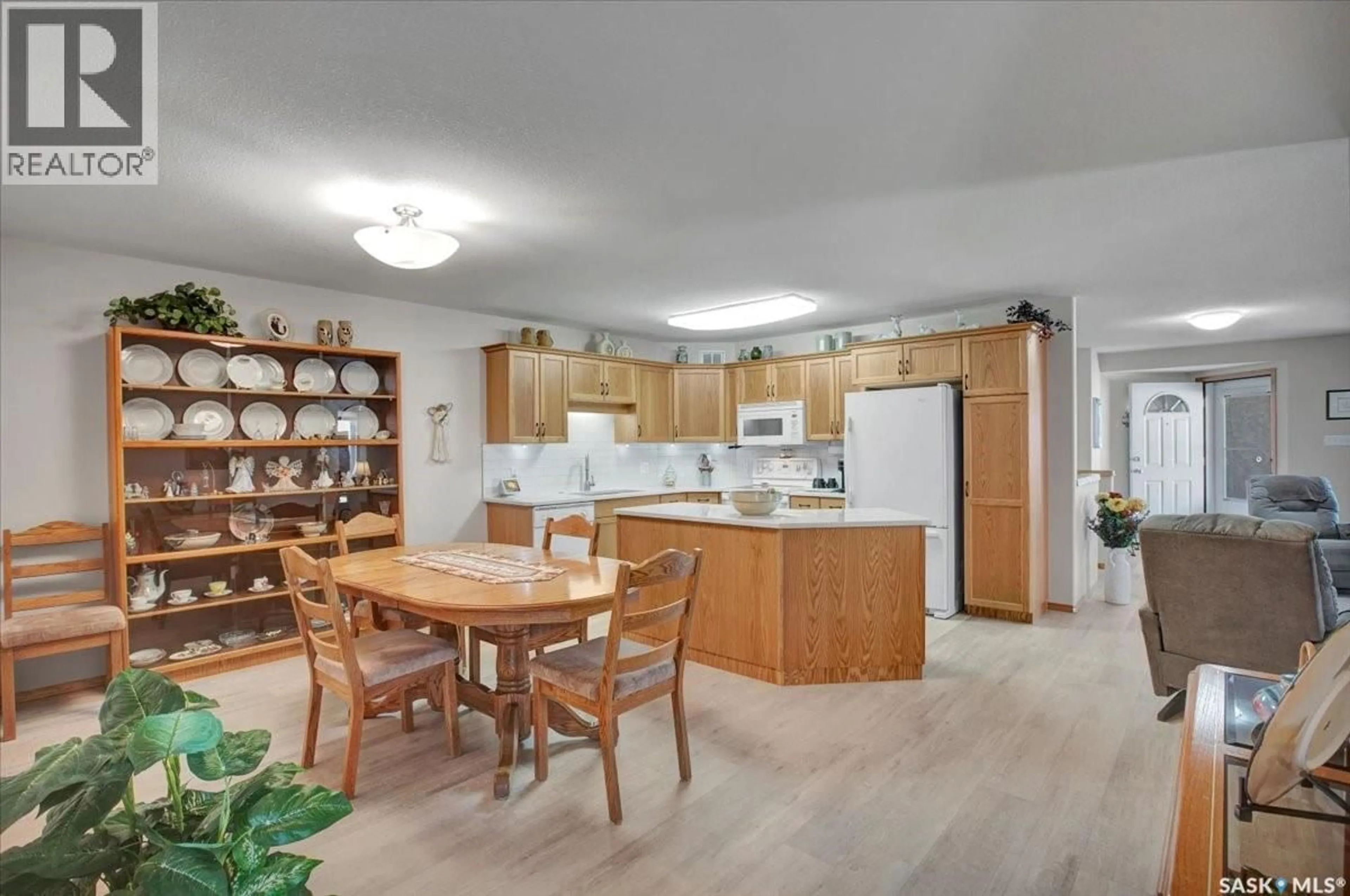 Open concept kitchen, wood/laminate floor for 4 CRYSTAL WAY, Warman Saskatchewan S0K0A1