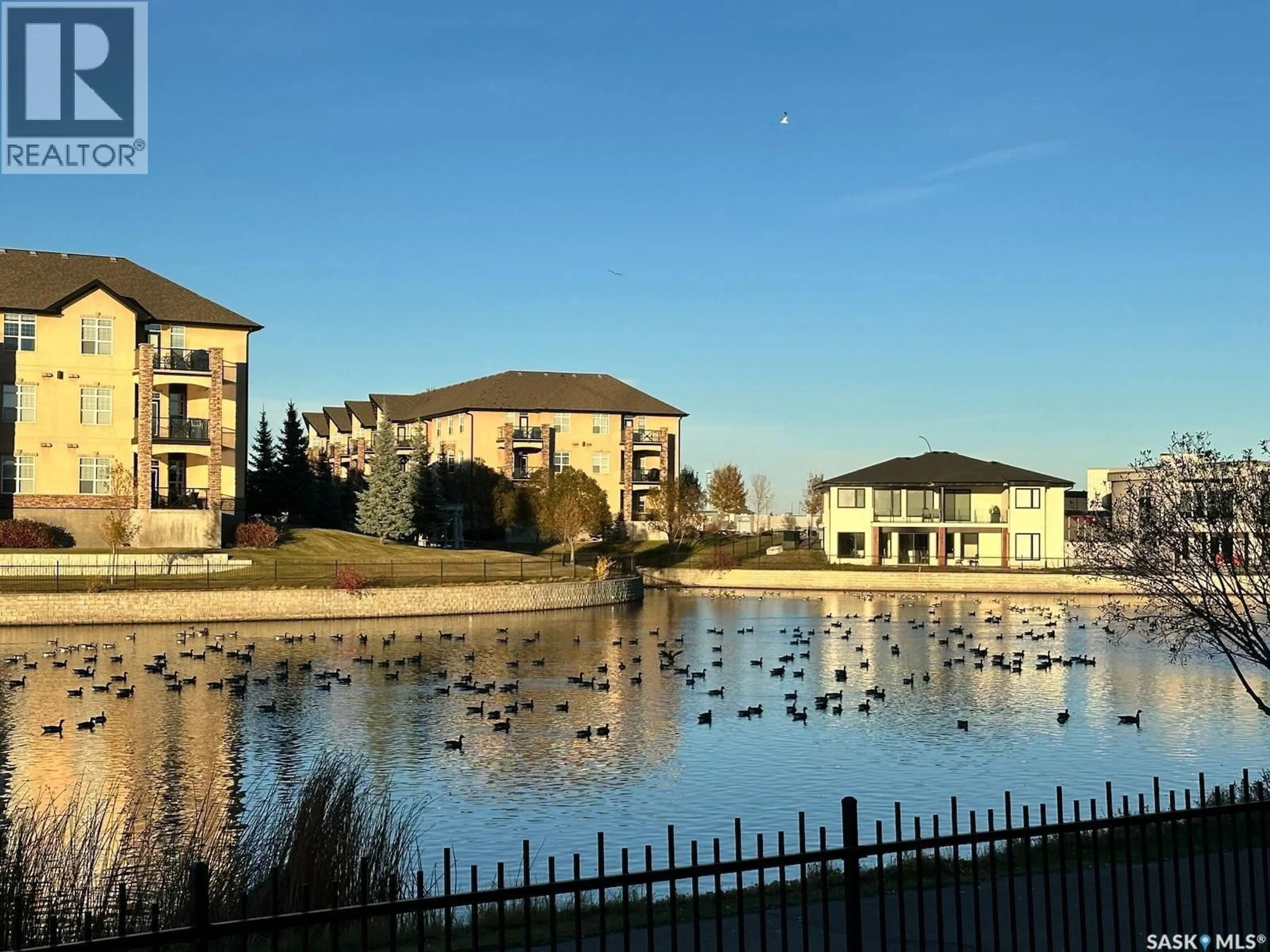 A pic from outside/outdoor area/front of a property/back of a property/a pic from drone, water/lake/river/ocean view for 3 2400 TELL PLACE, Regina Saskatchewan S4V3E3