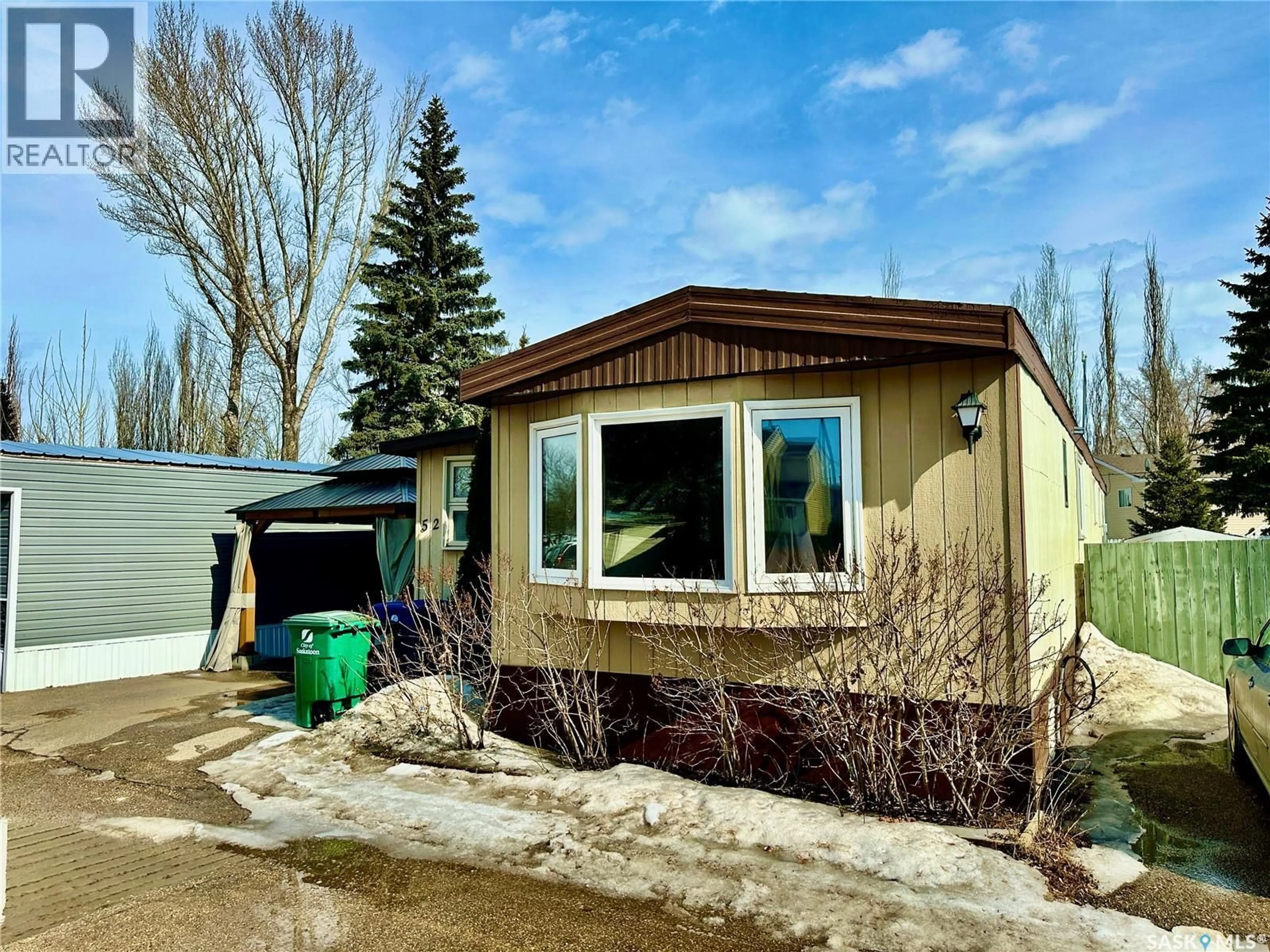 Home with vinyl exterior material, street for 52 219 GRANT STREET, Saskatoon Saskatchewan S7N2A5