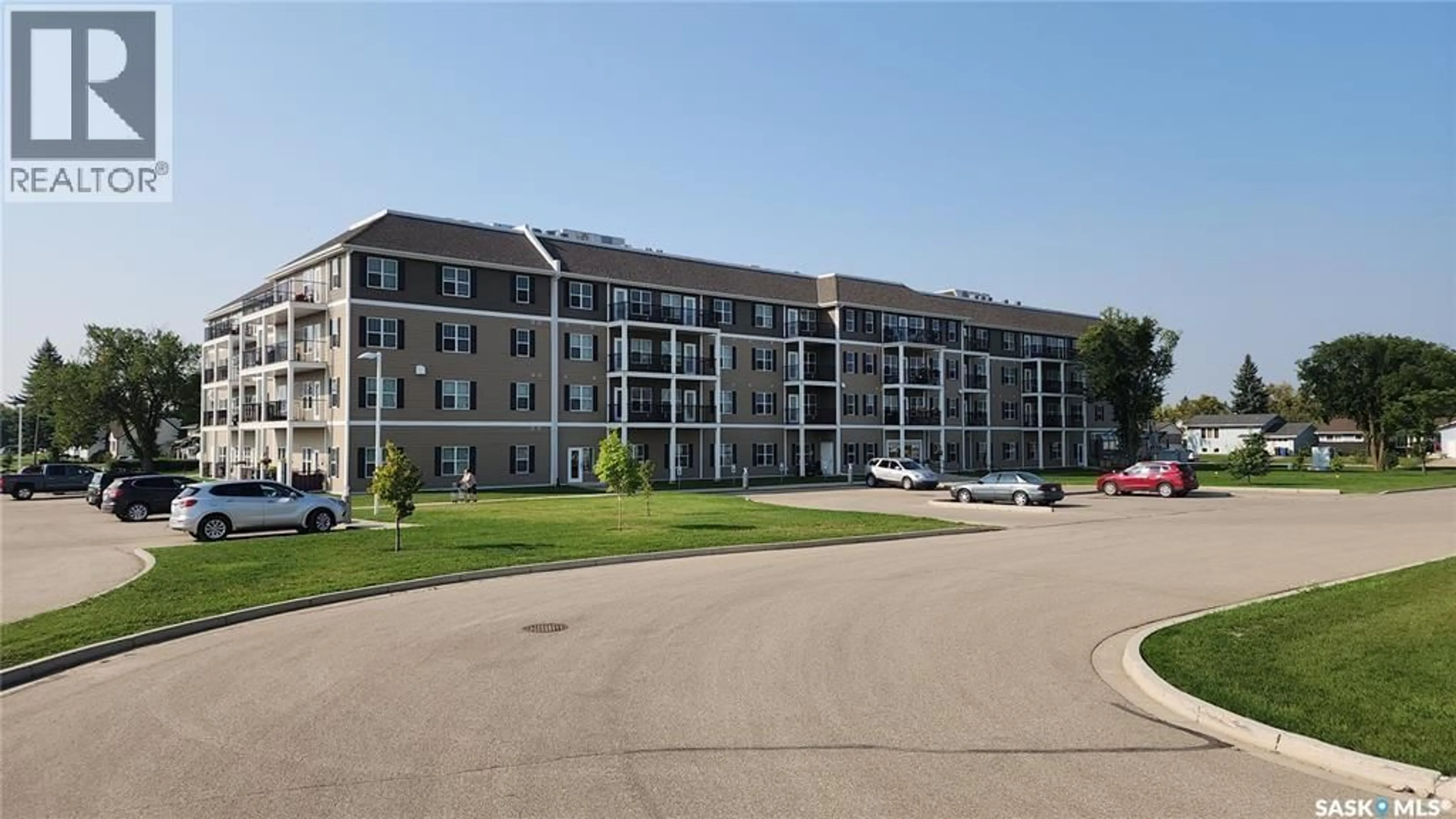A pic from outside/outdoor area/front of a property/back of a property/a pic from drone, building for E - 225 680 7TH AVENUE, Melville Saskatchewan S0A2P0