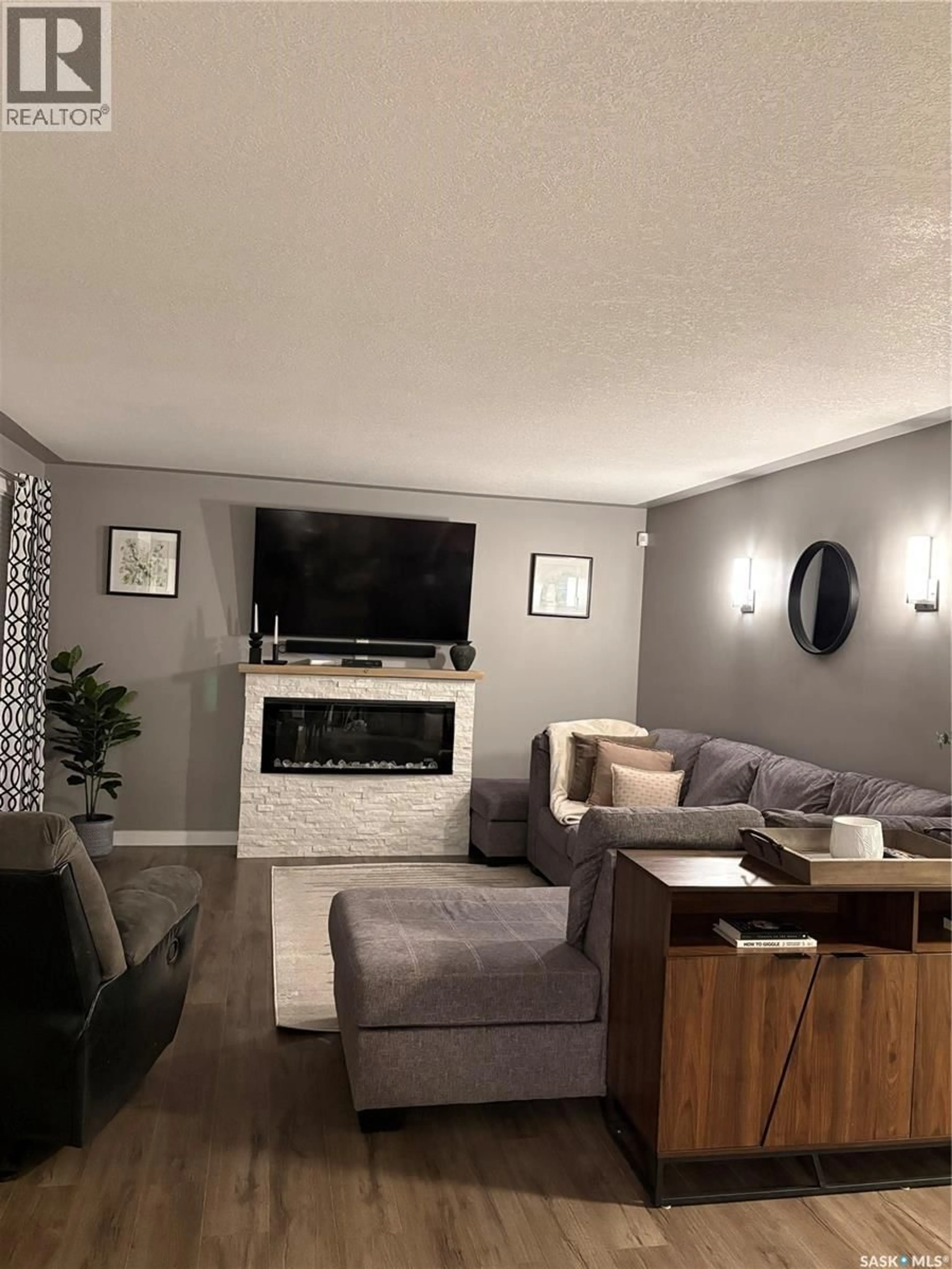Living room with furniture, wood/laminate floor for 412 5TH STREET, Ituna Saskatchewan S0A1N0