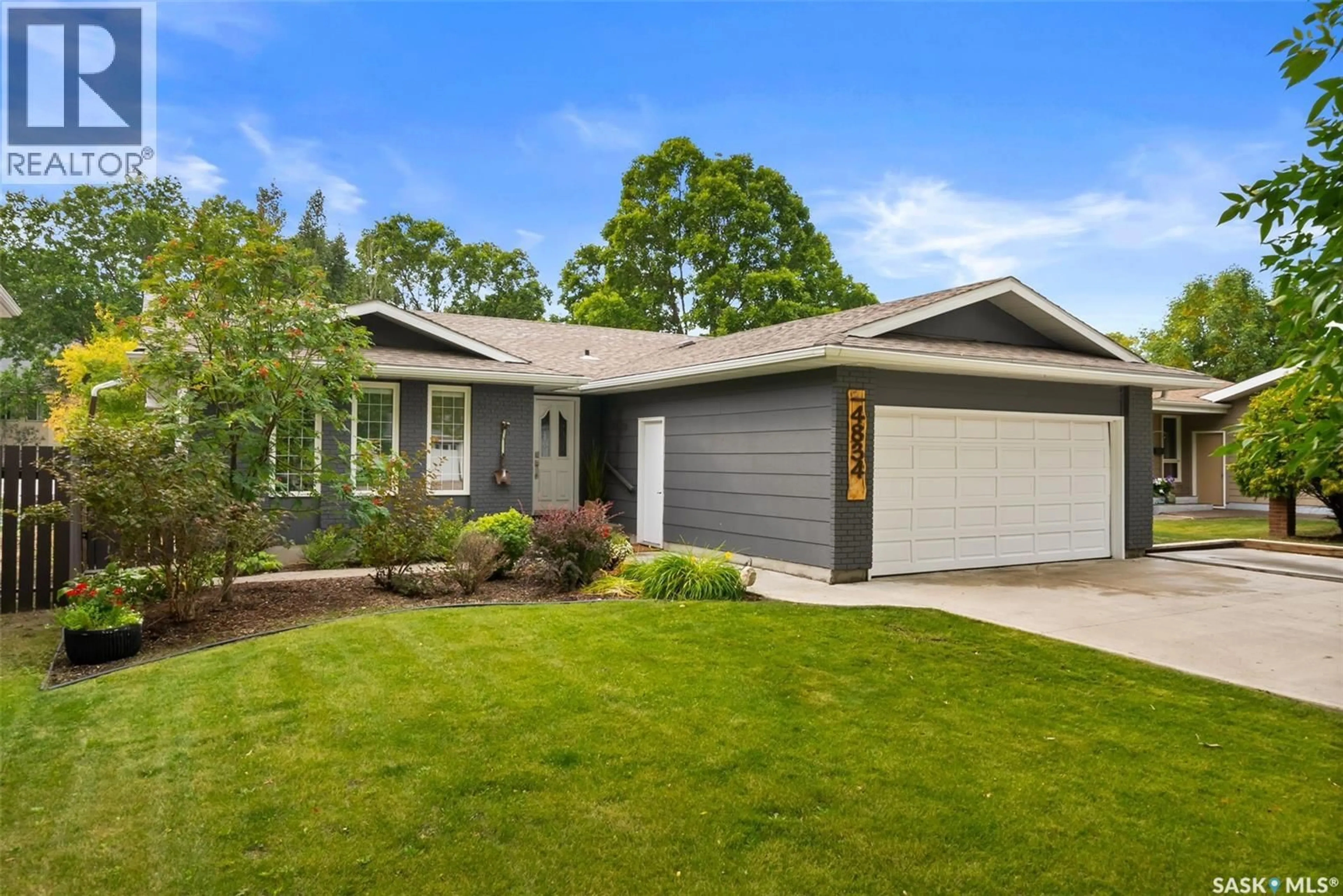 Home with vinyl exterior material, street for 4834 QUEEN STREET, Regina Saskatchewan S4S6V8