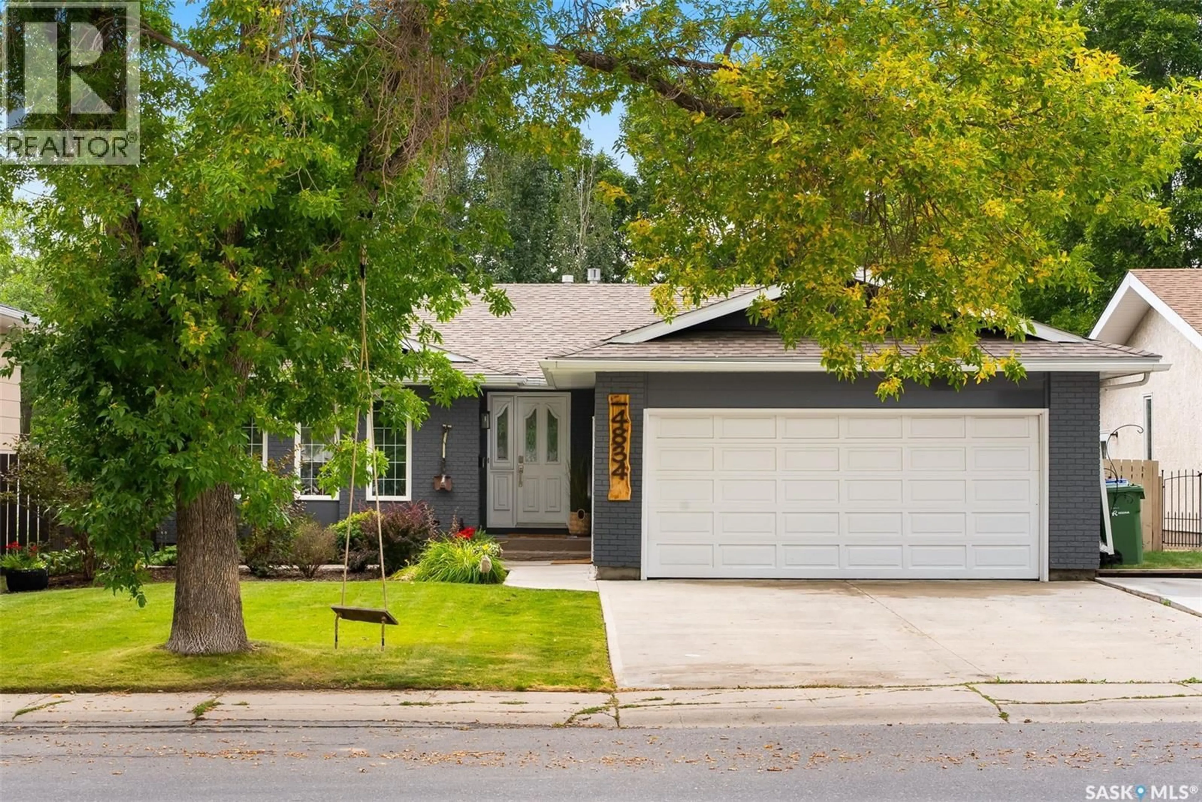 Home with vinyl exterior material, street for 4834 QUEEN STREET, Regina Saskatchewan S4S6V8
