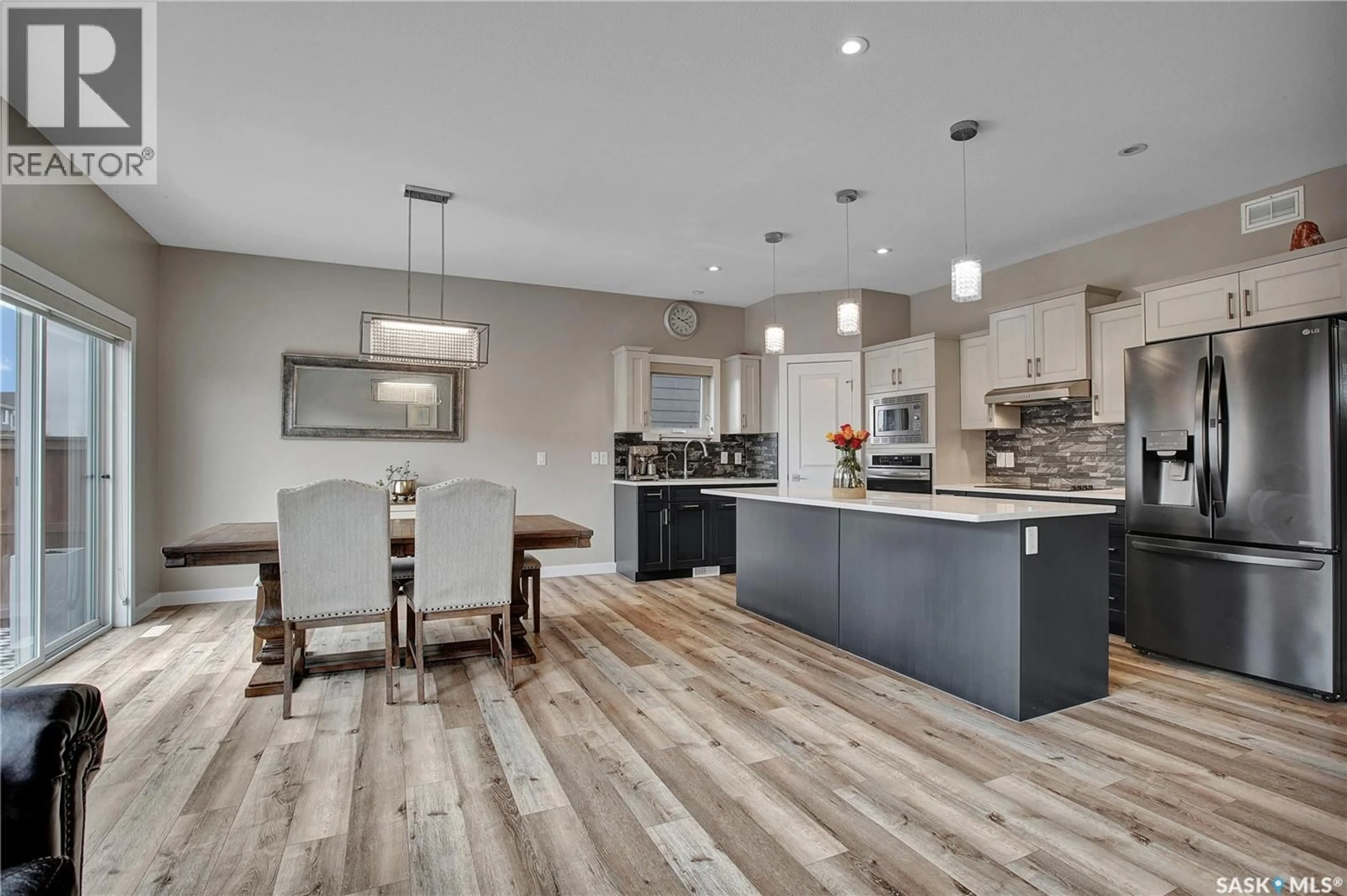 Open concept kitchen, wood/laminate floor for 211 STILLING, Saskatoon Saskatchewan S7V0V3