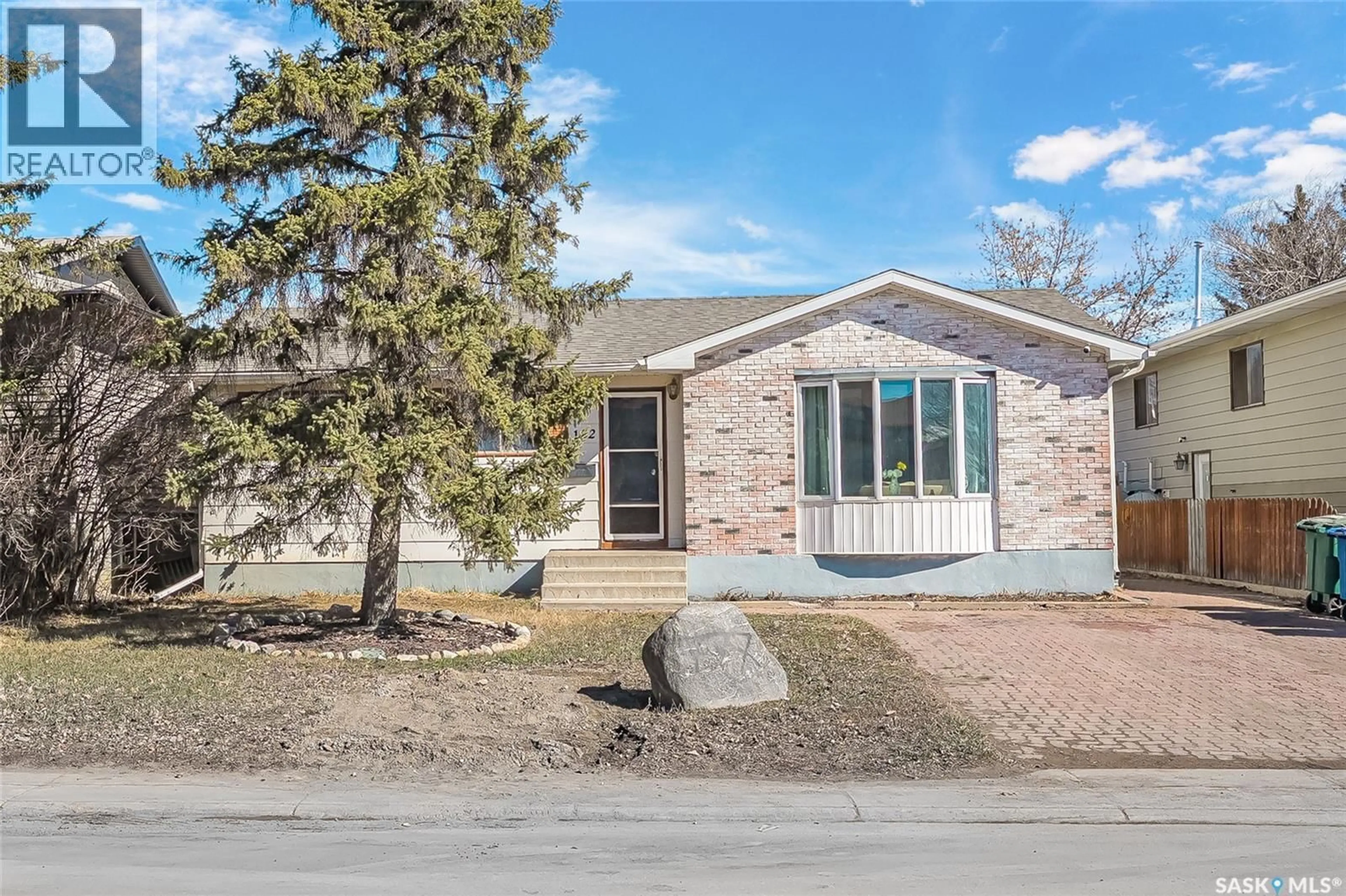 Home with brick exterior material, street for 122 CLANCY DRIVE, Saskatoon Saskatchewan S7M4L2