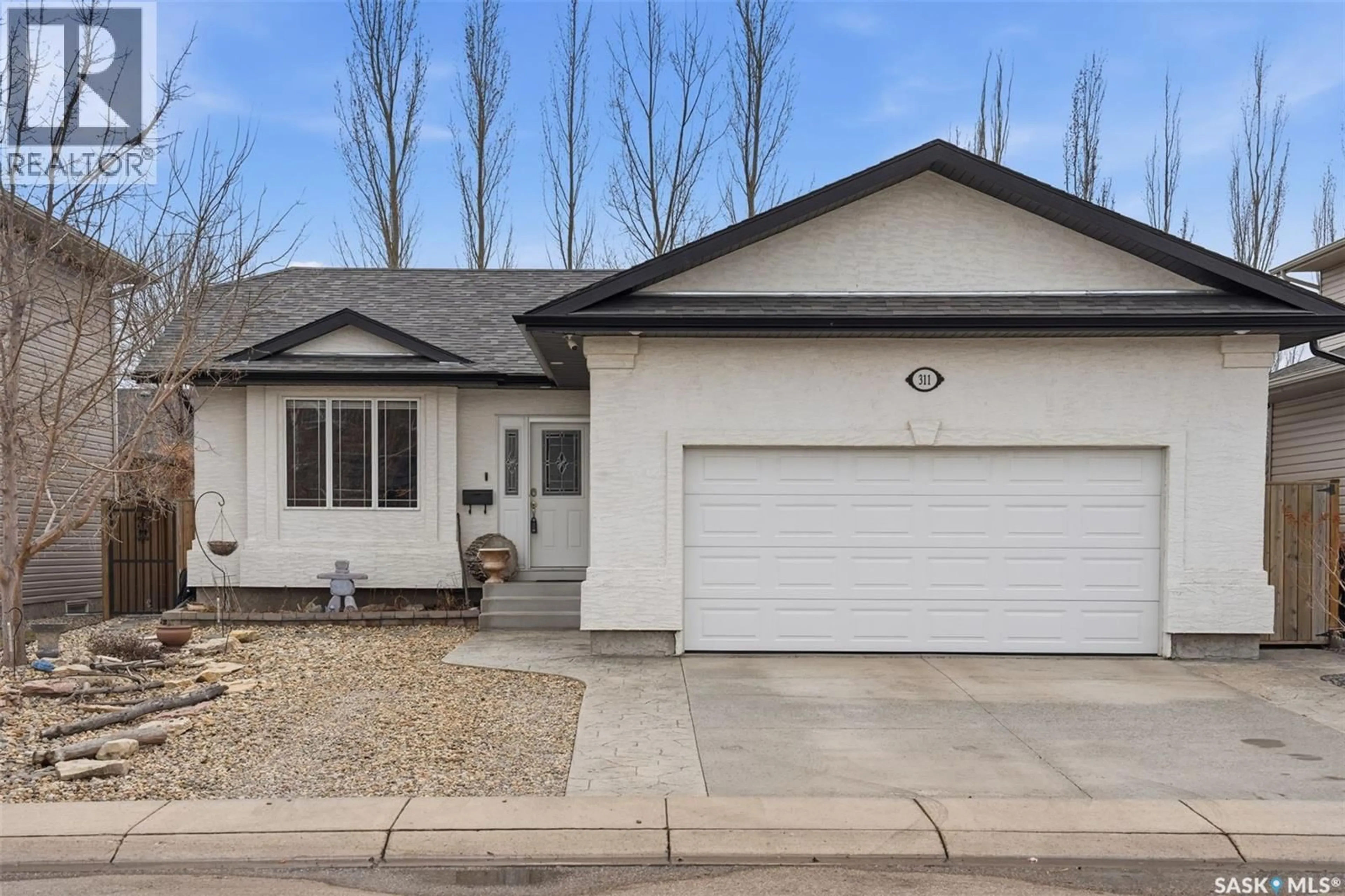 Home with vinyl exterior material, street for 311 MCKAGUE CRESCENT, Saskatoon Saskatchewan S7R0A9