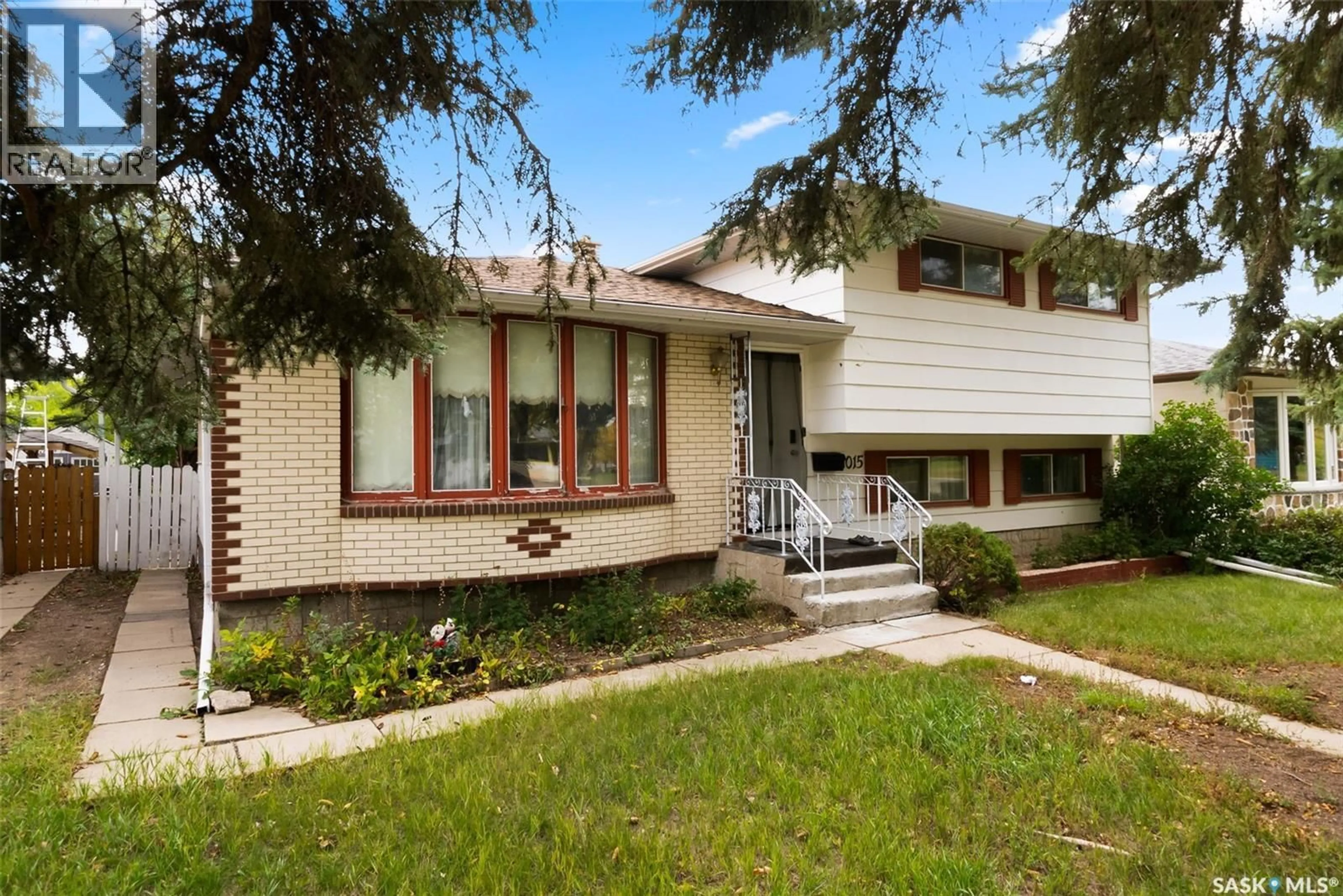 Home with brick exterior material, street for 1015 12TH AVENUE, Regina Saskatchewan S4N4W1