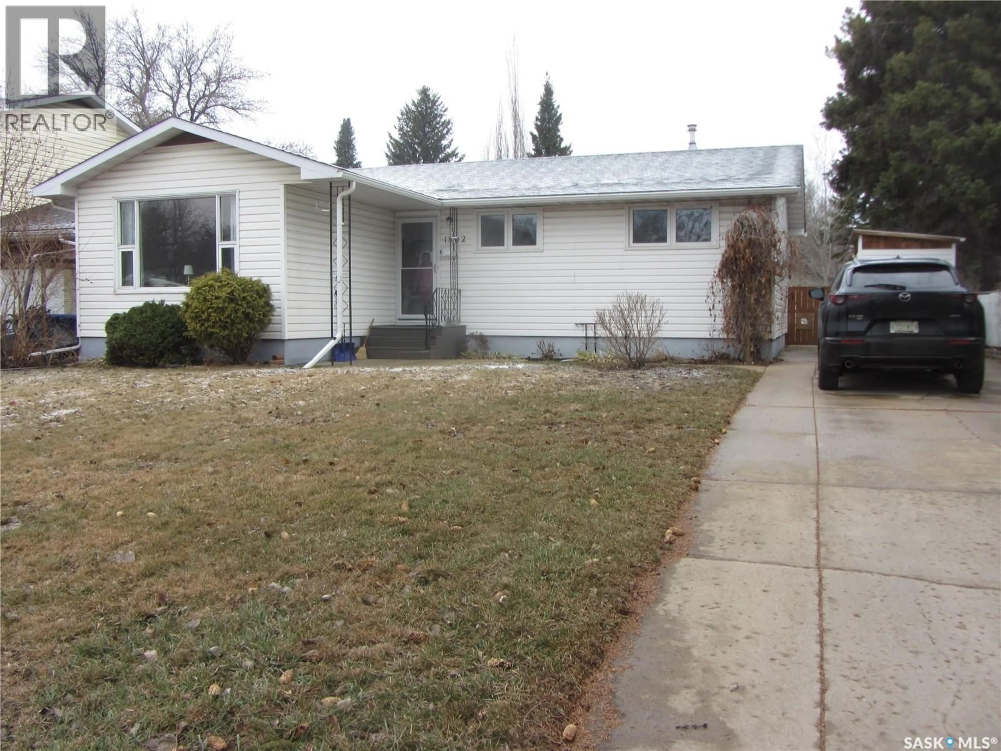 Home with vinyl exterior material, street for 1802 ARLINGTON AVENUE, Saskatoon Saskatchewan S7H2Y7