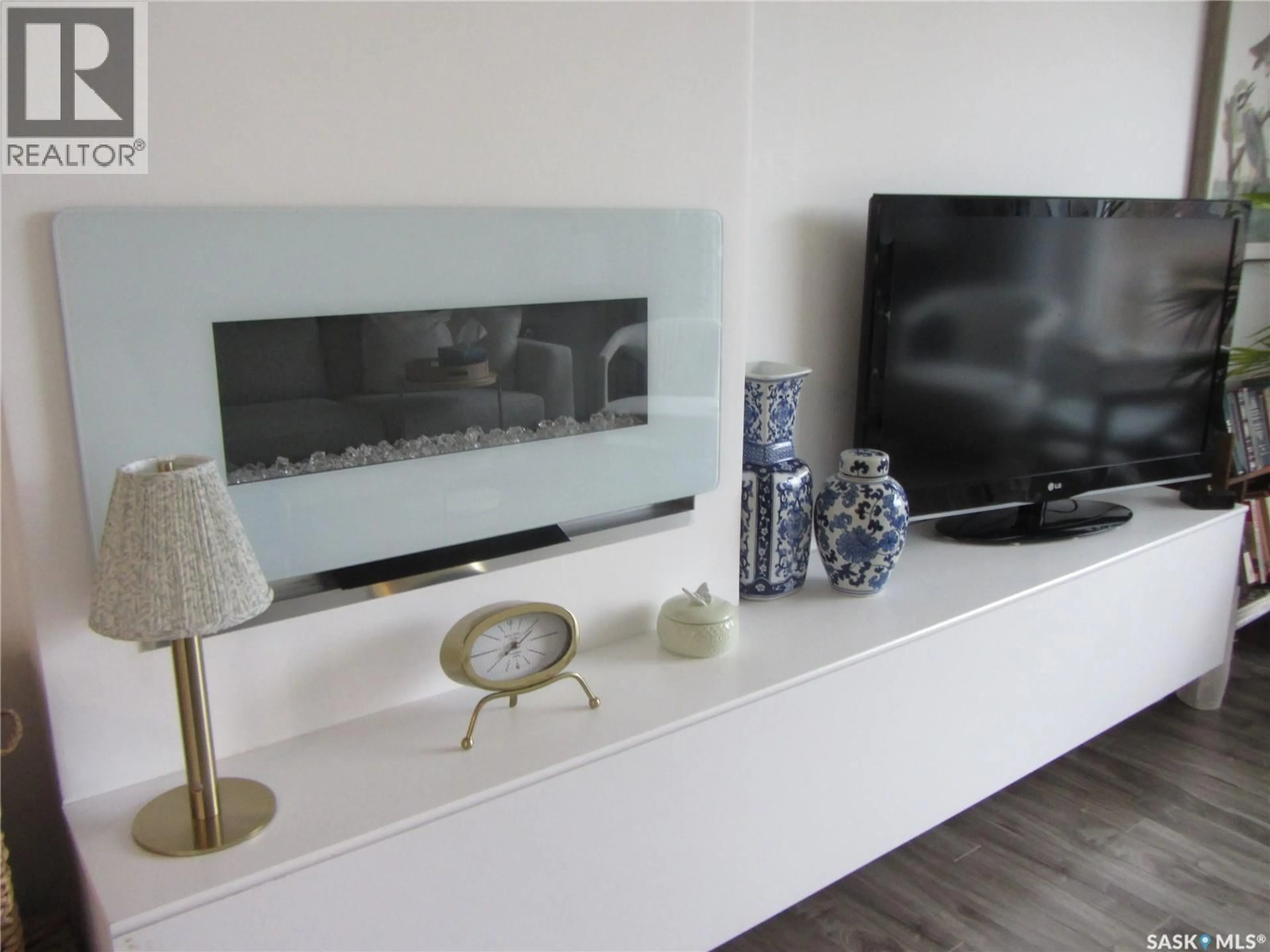 Living room with furniture, wood/laminate floor for 1802 ARLINGTON AVENUE, Saskatoon Saskatchewan S7H2Y7