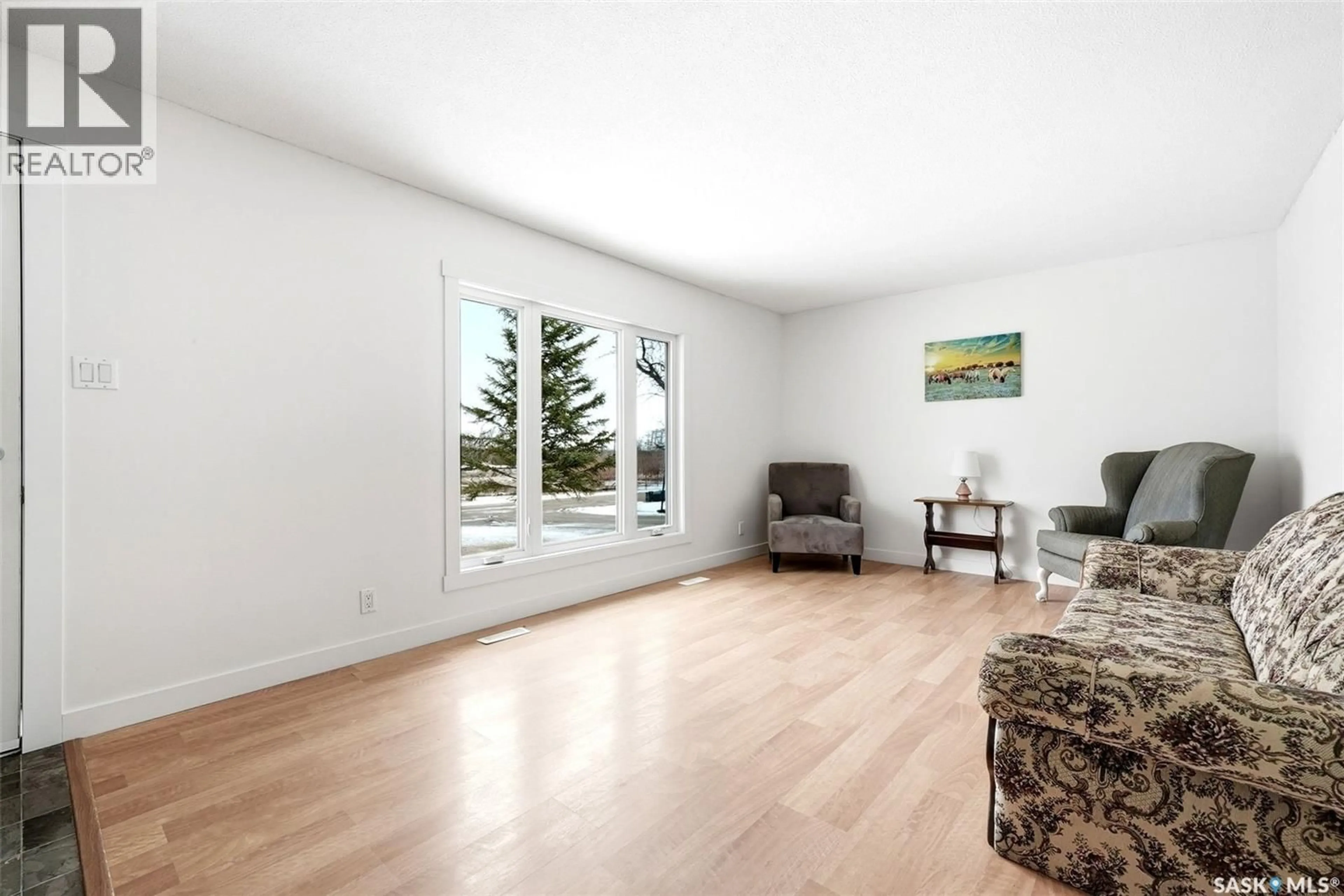 Living room with furniture, wood/laminate floor for 112 1ST AVENUE, Edenwold Saskatchewan S0G1K0