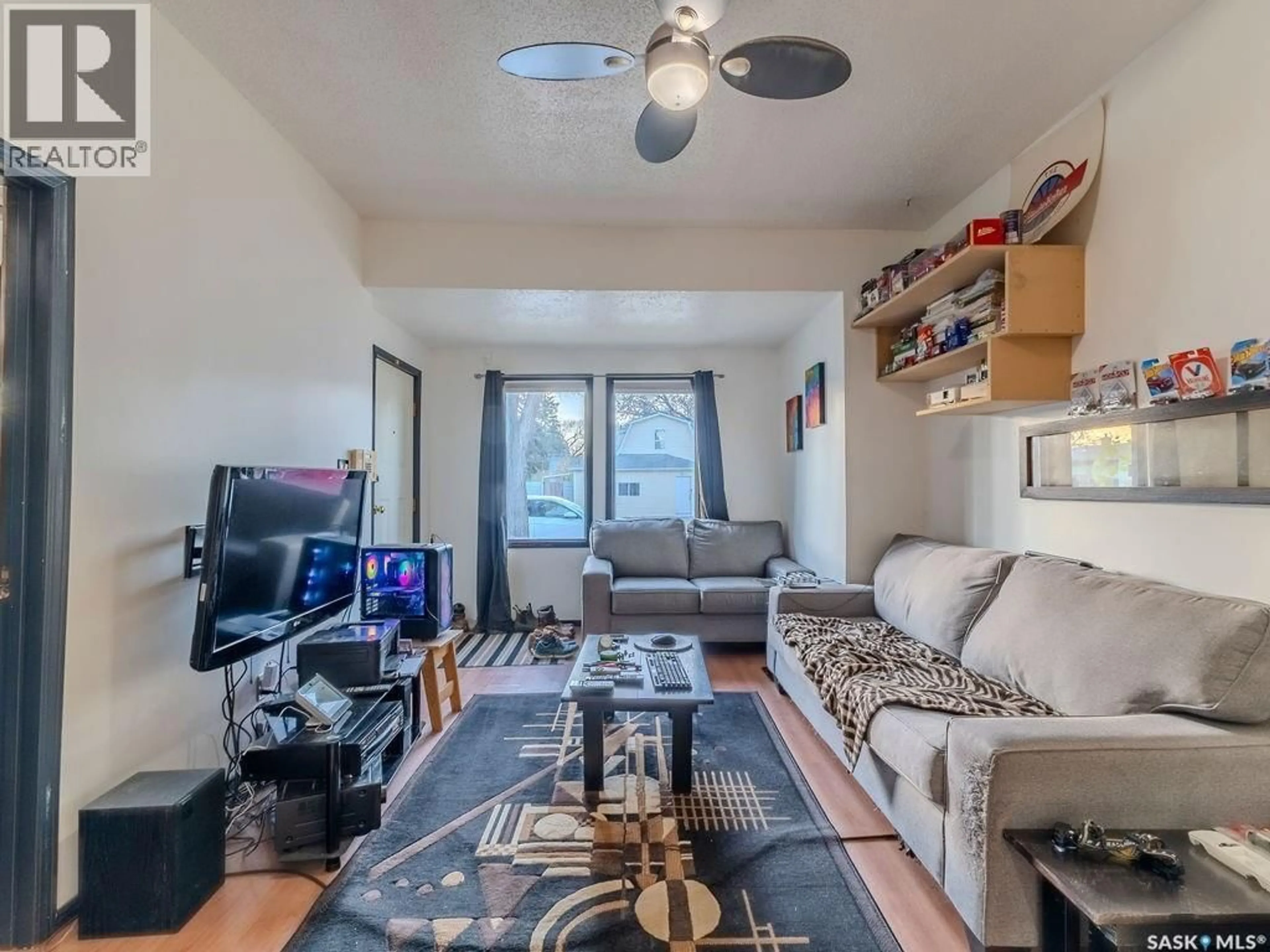 Living room with furniture, unknown for 710 I AVENUE, Saskatoon Saskatchewan S7M1Y9