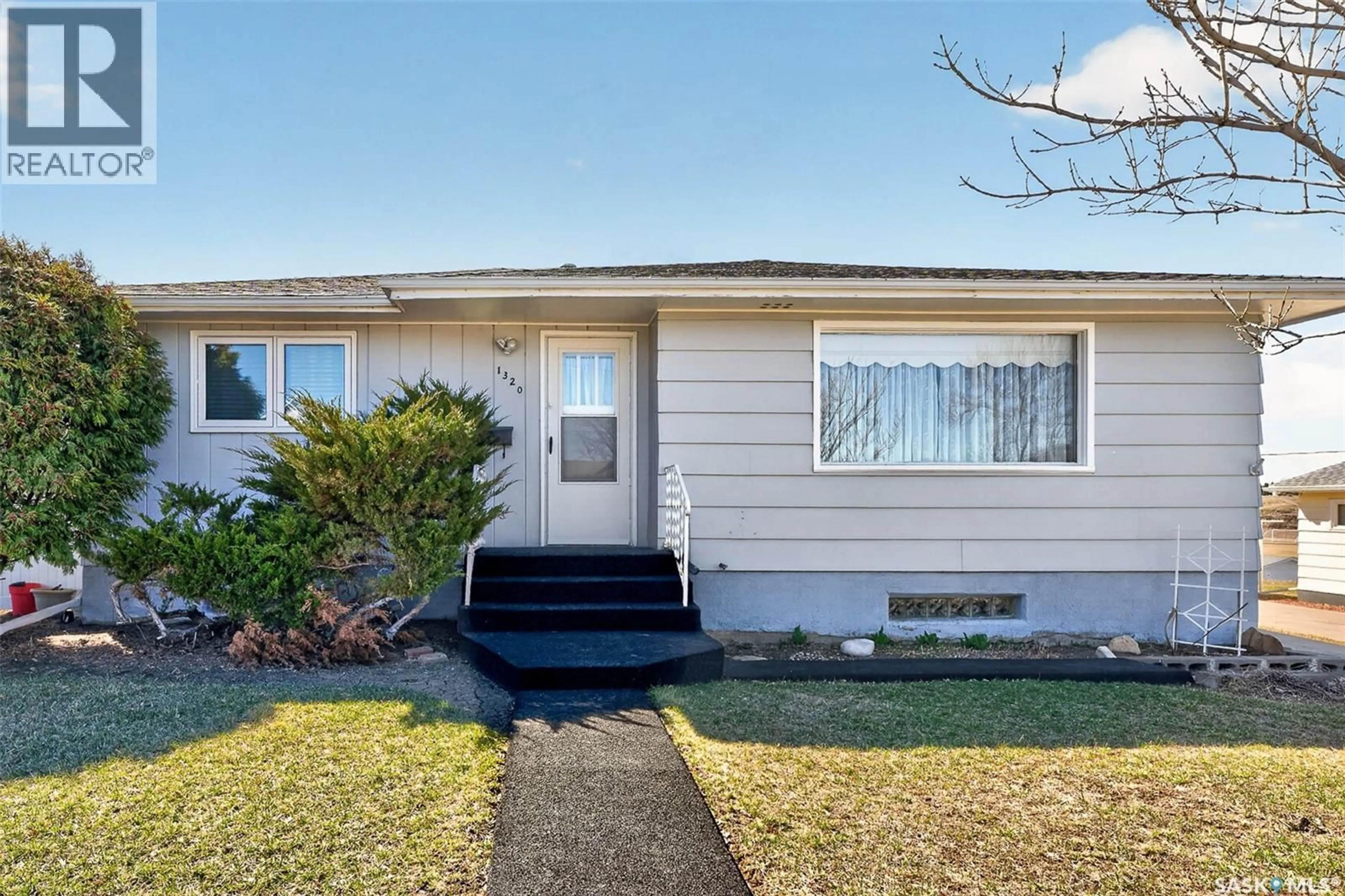 Home with vinyl exterior material, street for 1320 GRAFTON AVENUE, Moose Jaw Saskatchewan S6H3S8