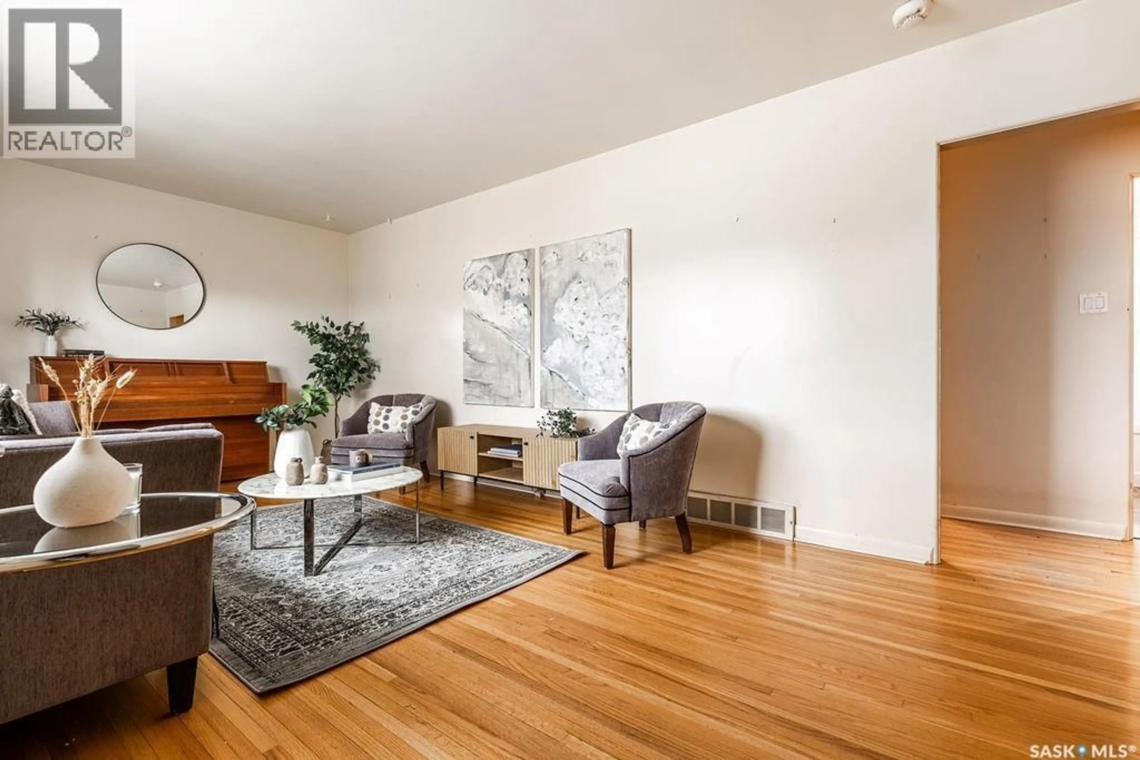 Living room with furniture, wood/laminate floor for 1609 PARK AVENUE, Saskatoon Saskatchewan S7H2P2