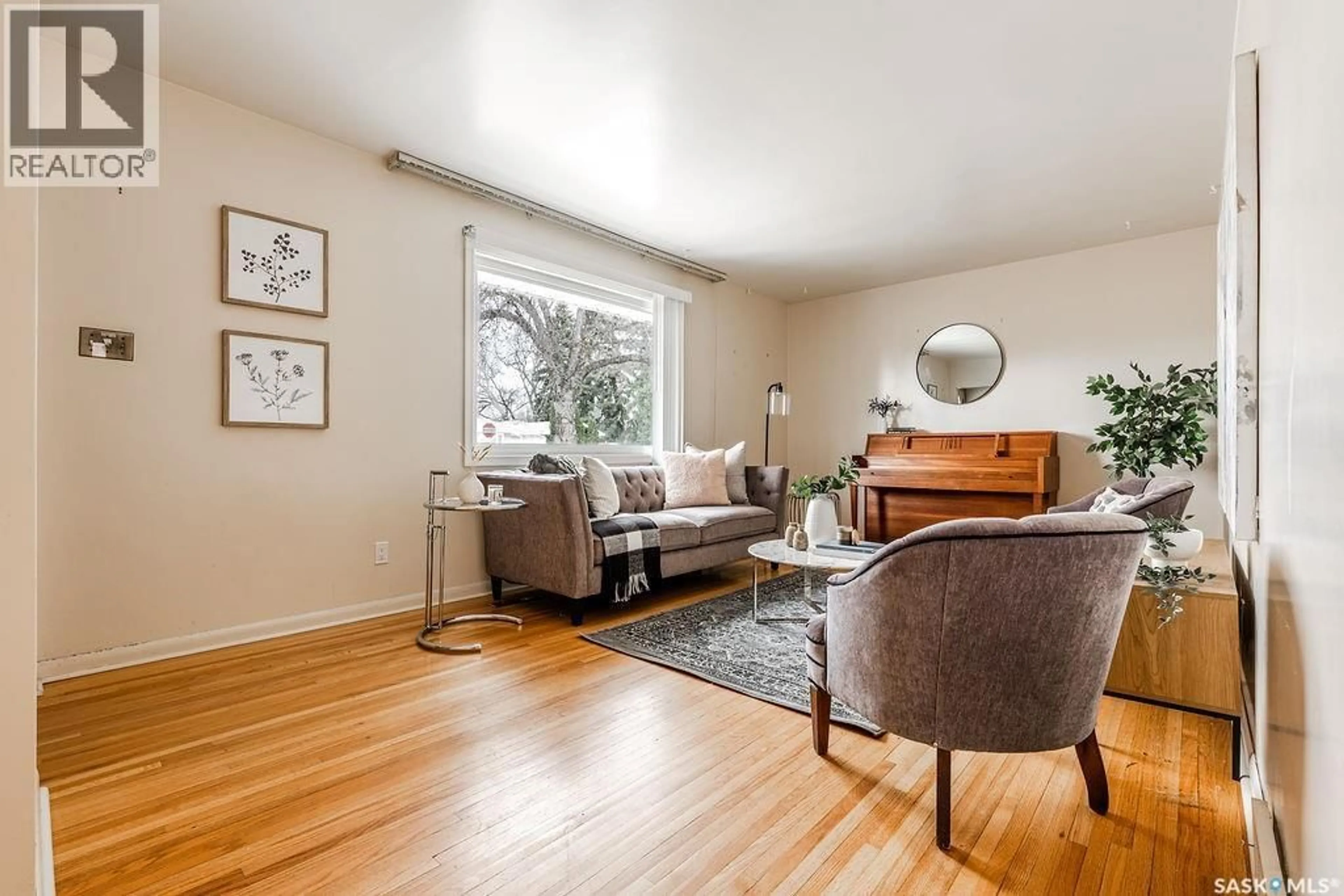 Living room with furniture, wood/laminate floor for 1609 PARK AVENUE, Saskatoon Saskatchewan S7H2P2