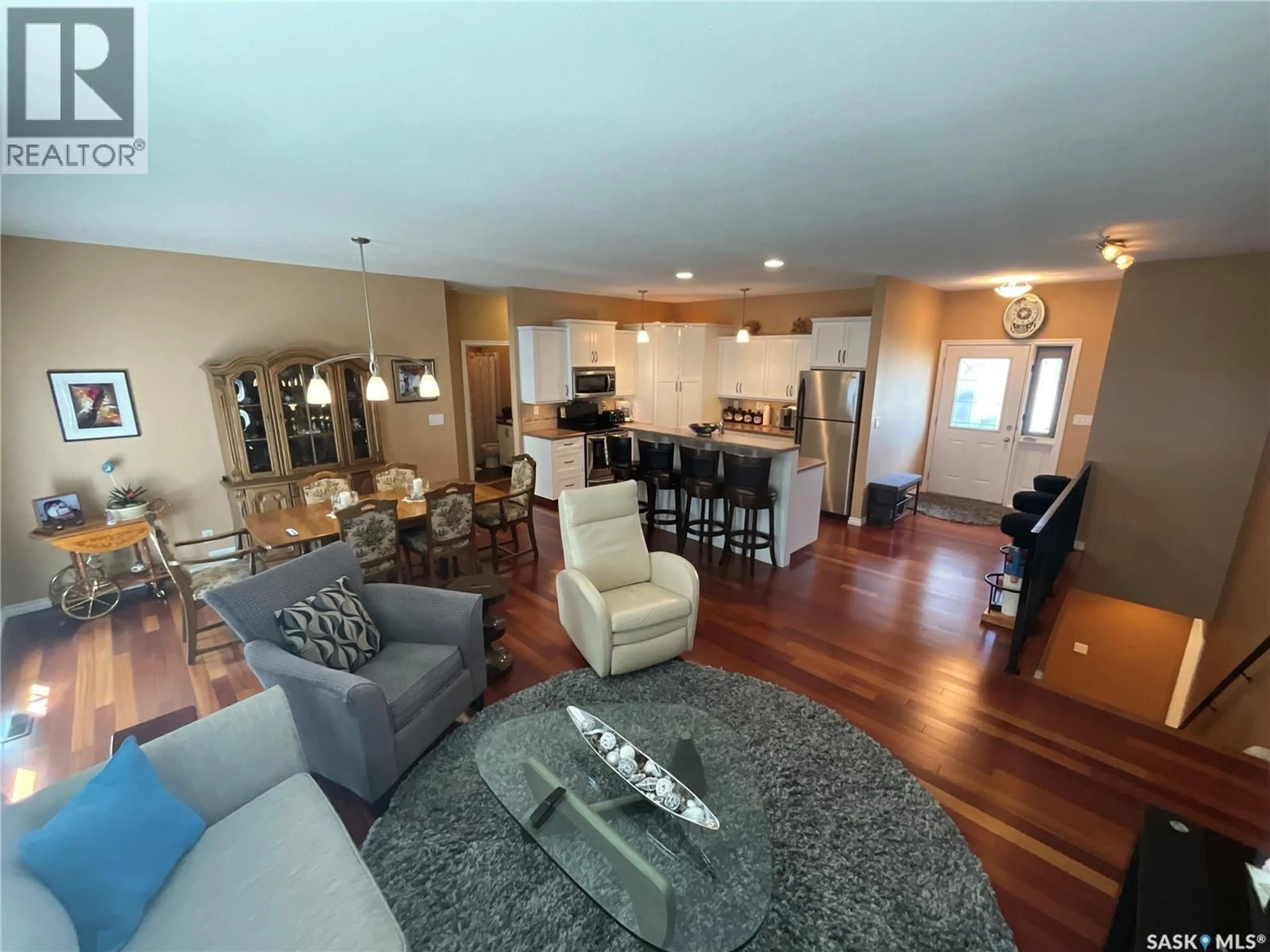 Living room with furniture, wood/laminate floor for 15 - 1590 4TH AVENUE, Moose Jaw Saskatchewan S6J0A5