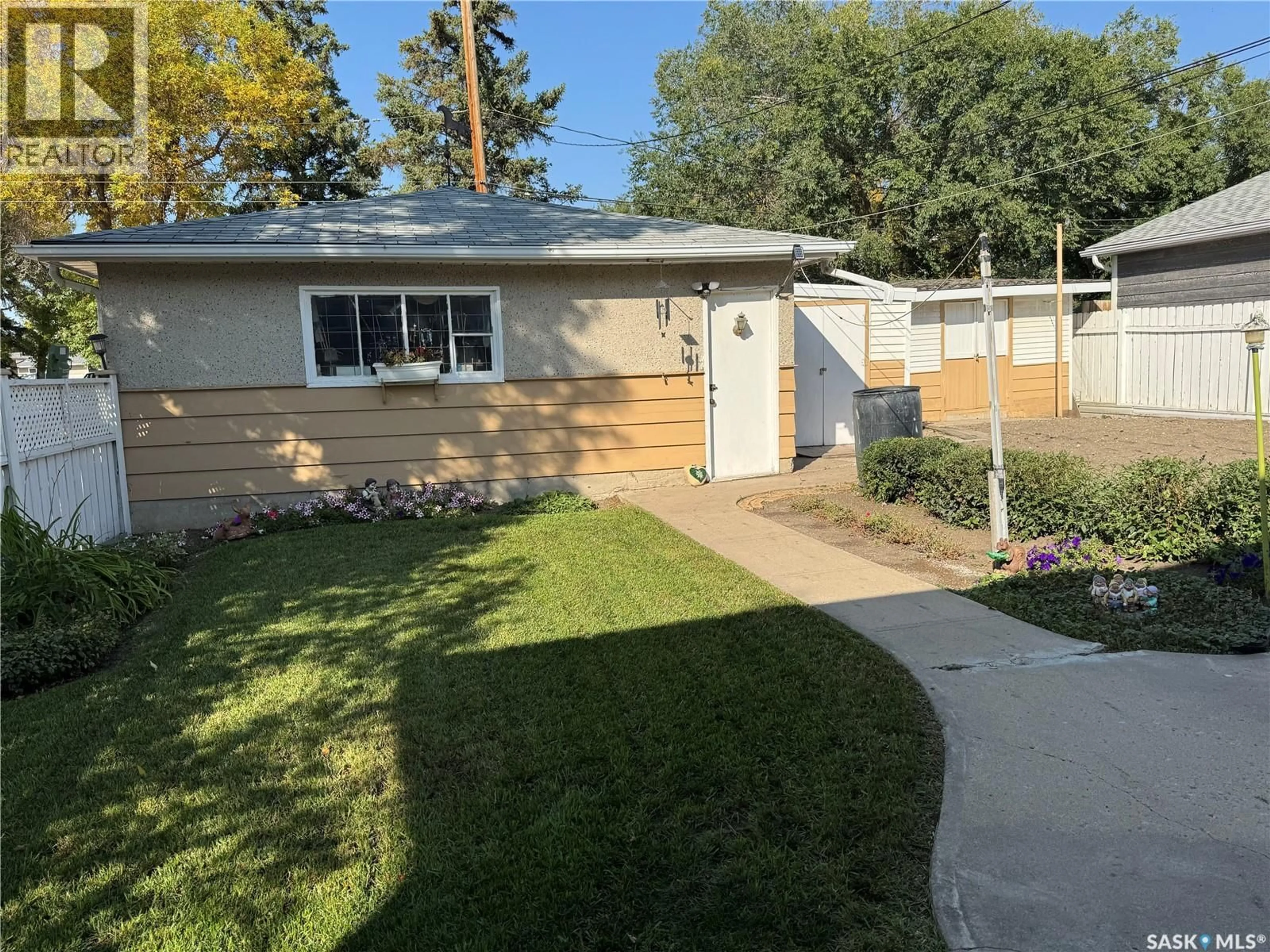 Home with vinyl exterior material, street for 1200 12TH AVENUE, Regina Saskatchewan S4N0M5