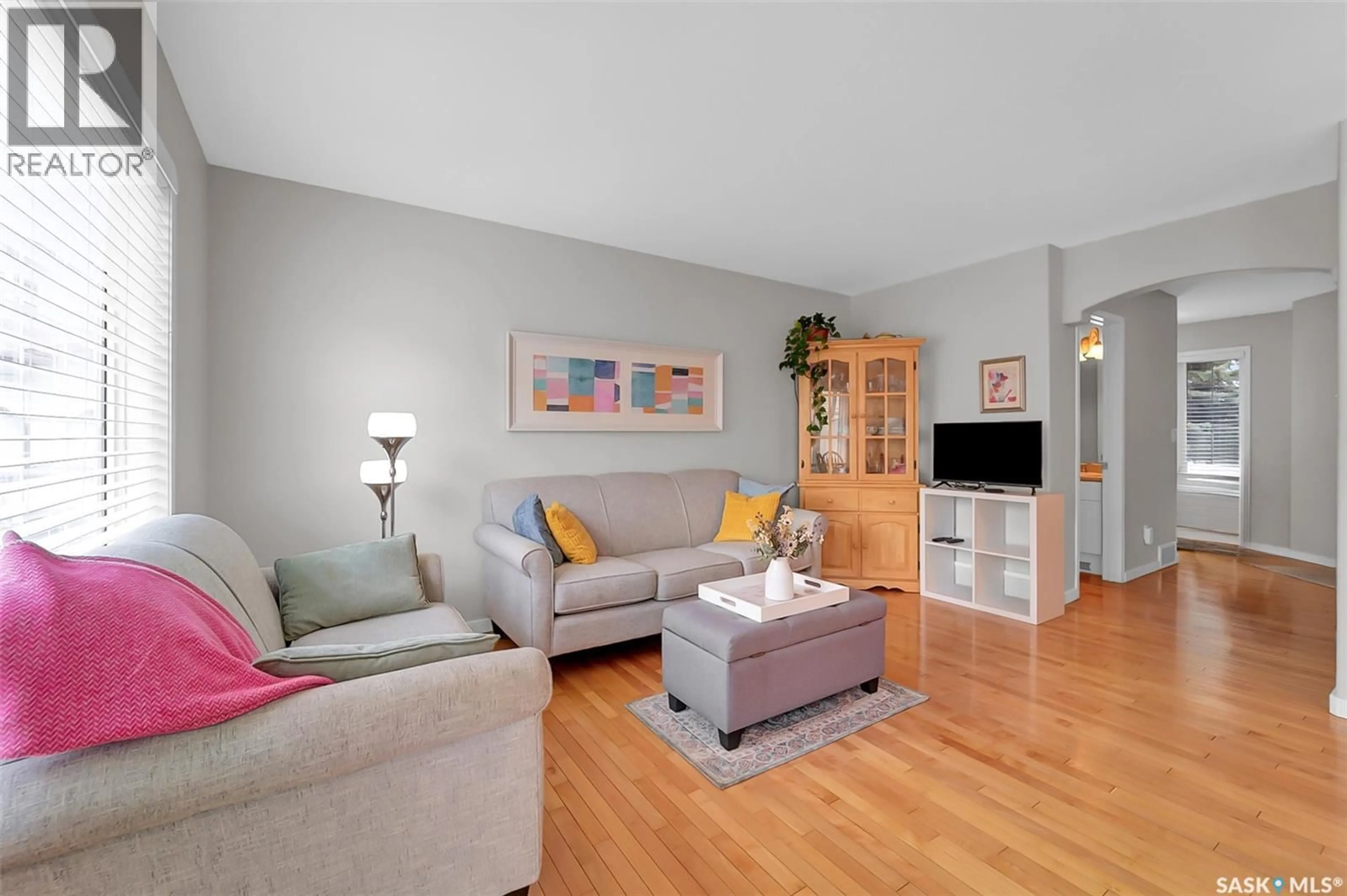 Living room with furniture, wood/laminate floor for 615 - 206 KENDERDINE ROAD, Saskatoon Saskatchewan S7N4V1