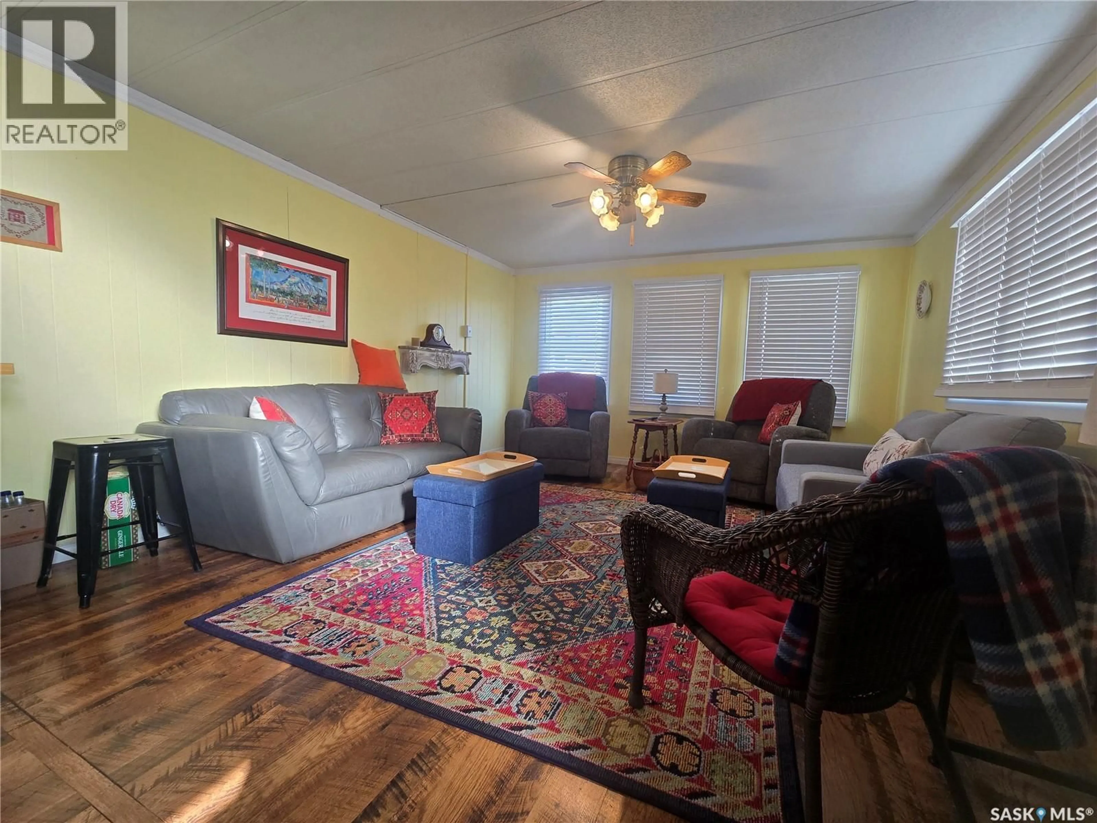 Living room with furniture, wood/laminate floor for 428 STANLEY STREET, Stoughton Saskatchewan S0G4T0