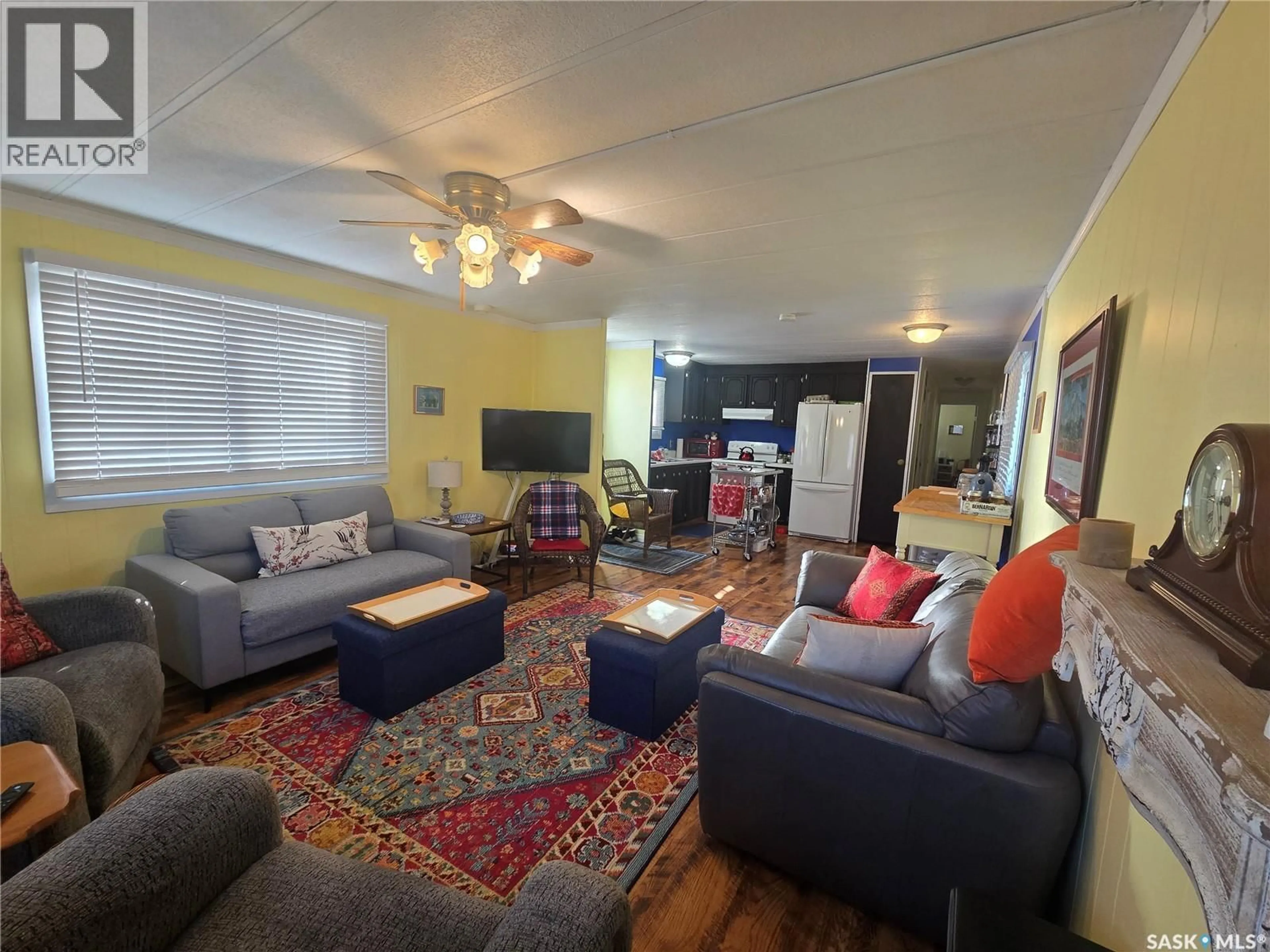 Living room with furniture, wood/laminate floor for 428 STANLEY STREET, Stoughton Saskatchewan S0G4T0