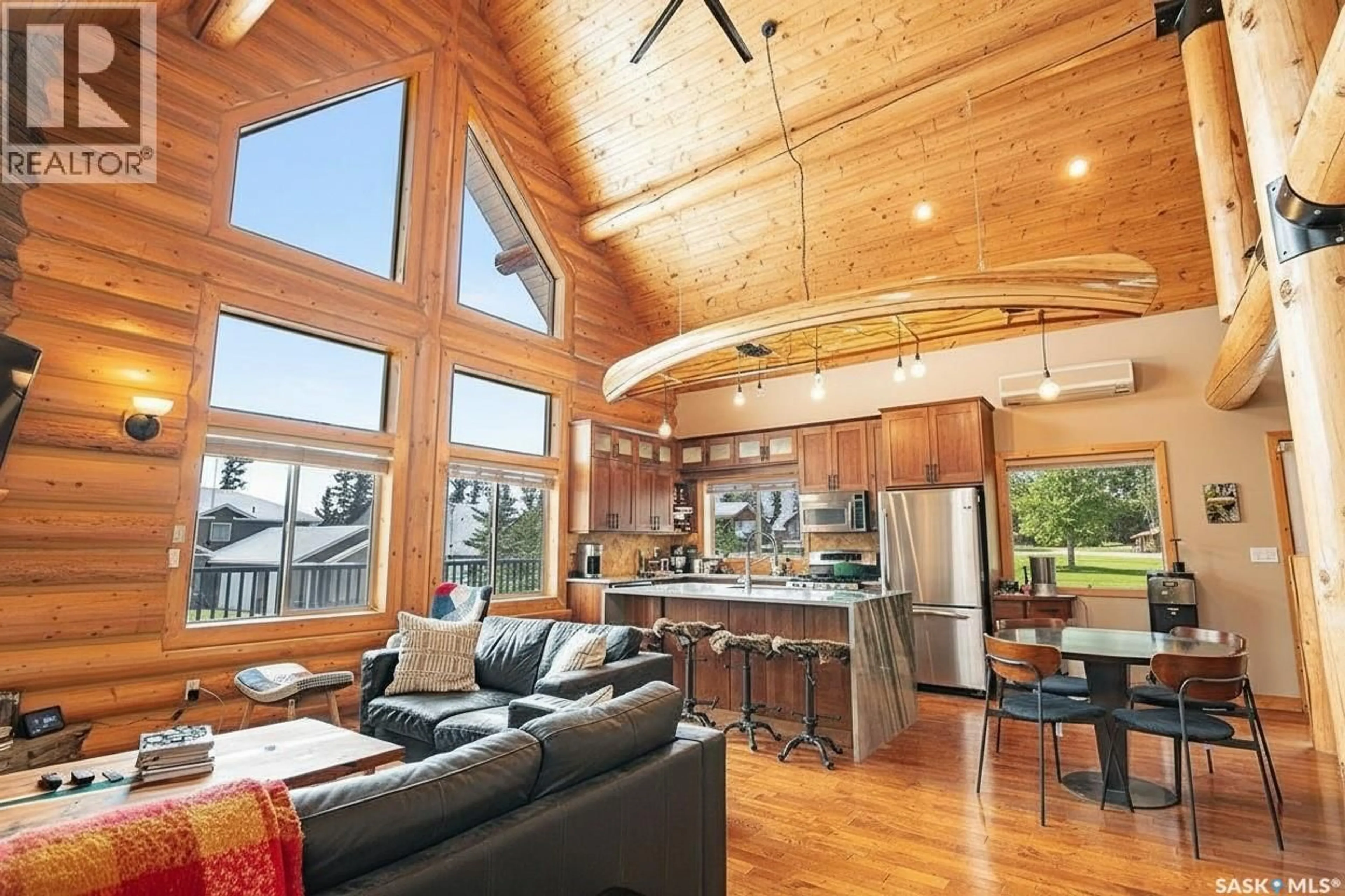 Open concept kitchen, wood/laminate floor for 16 ISLANDER DRIVE, Candle Lake Saskatchewan S0J3E0
