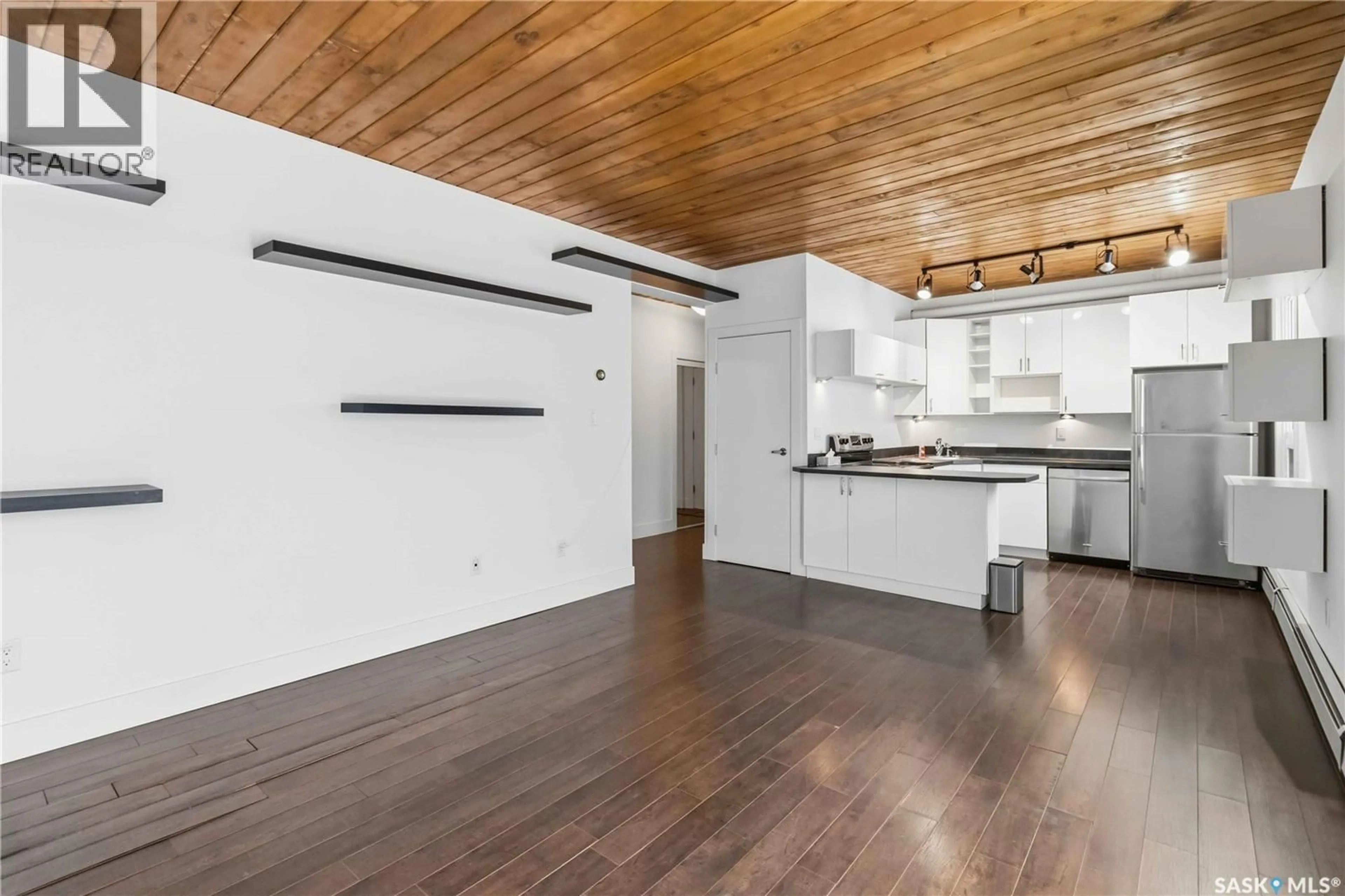 Open concept kitchen, wood/laminate floor for N - 301 415 3RD AVENUE, Saskatoon Saskatchewan S7K2J2