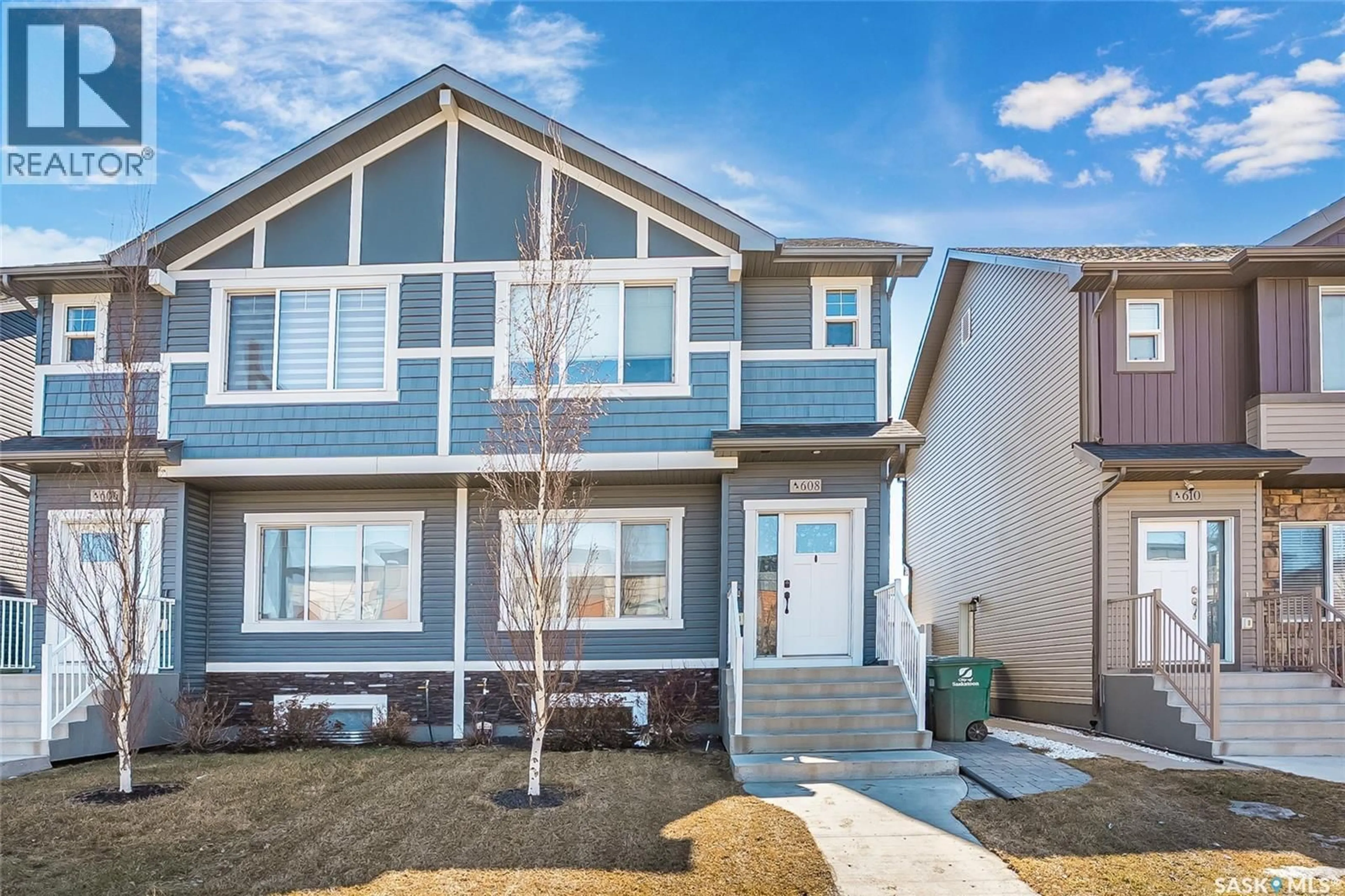 Home with vinyl exterior material, street for 608 BRIGHTON GATE, Saskatoon Saskatchewan S7V0V5