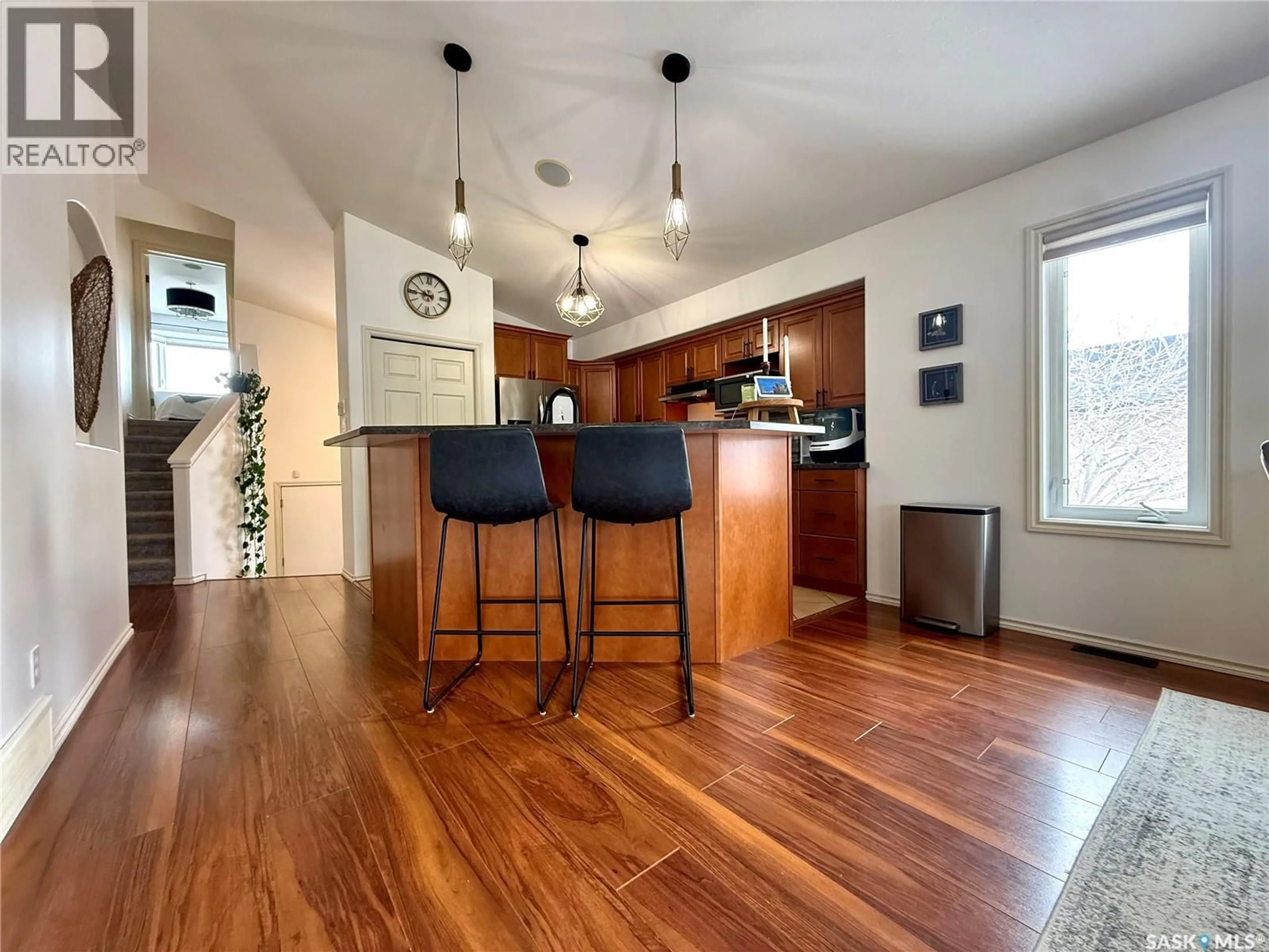 Open concept kitchen, wood/laminate floor for 78 ASPEN PLACE, Yorkton Saskatchewan S3N0C5