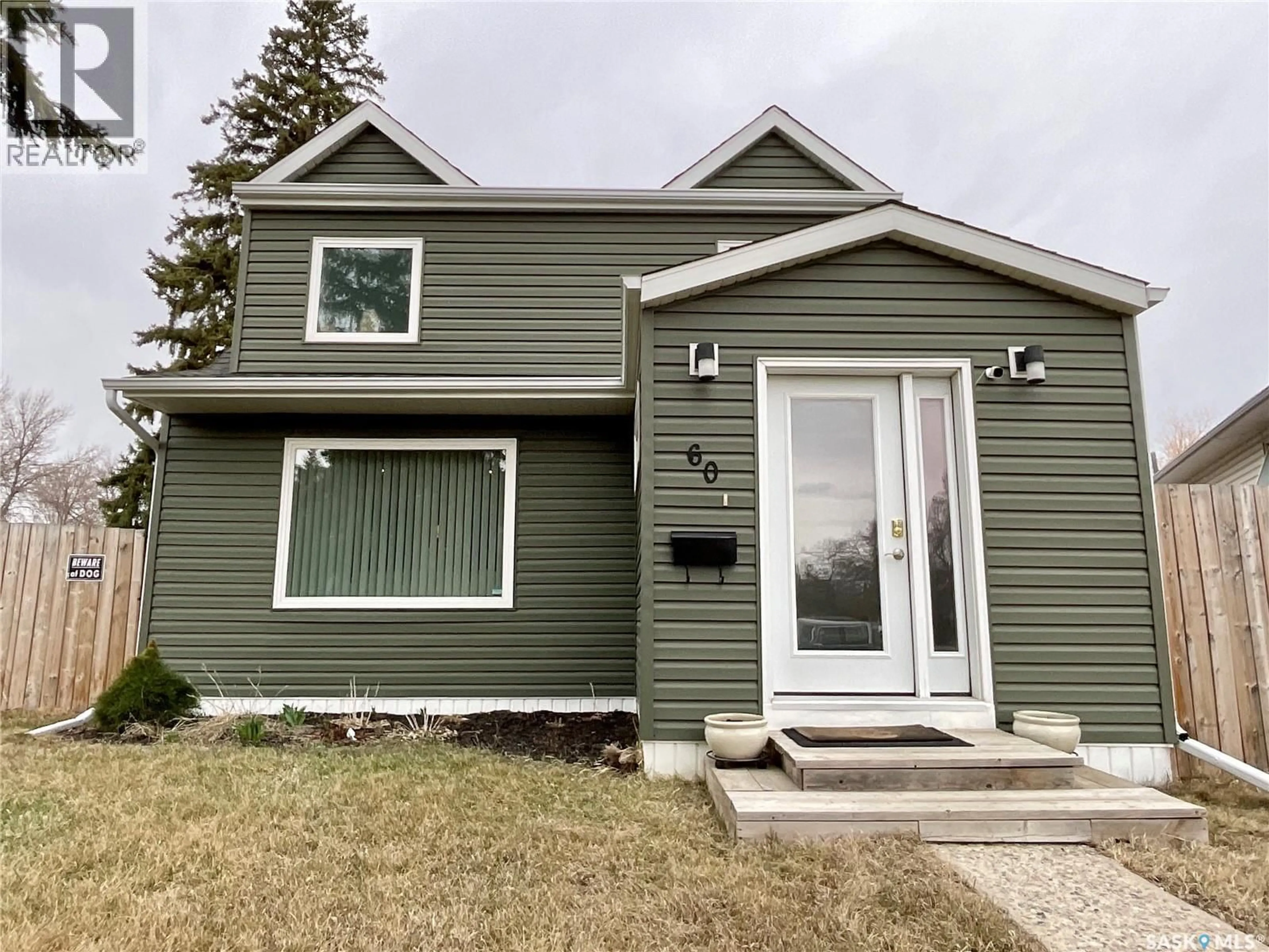 Home with vinyl exterior material, street for 60 CHARLES CRESCENT, Regina Saskatchewan S4T5X4