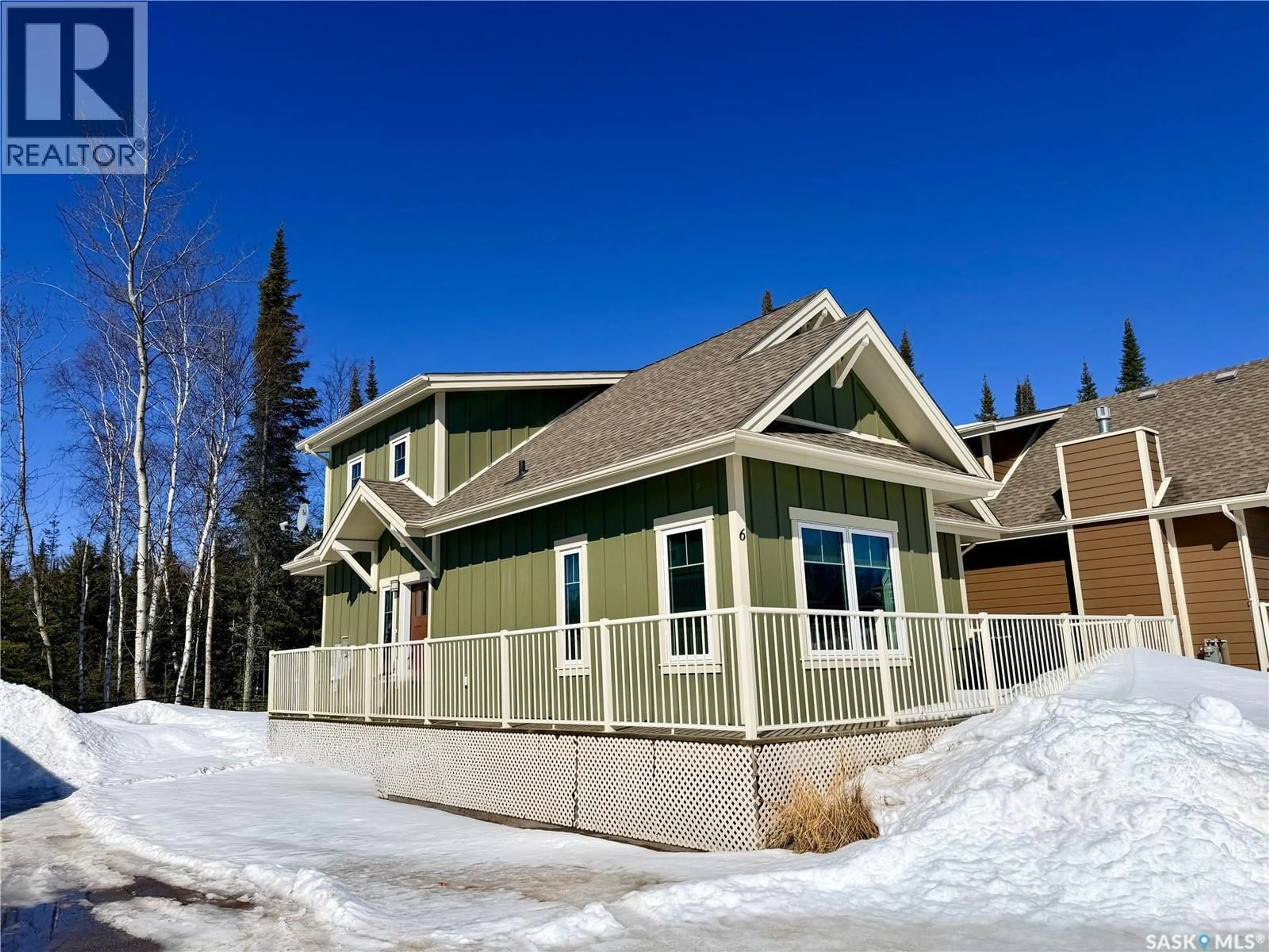 Home with vinyl exterior material, street for 6 ELKRIDGE DRIVE, Elk Ridge Saskatchewan S0J2Y0